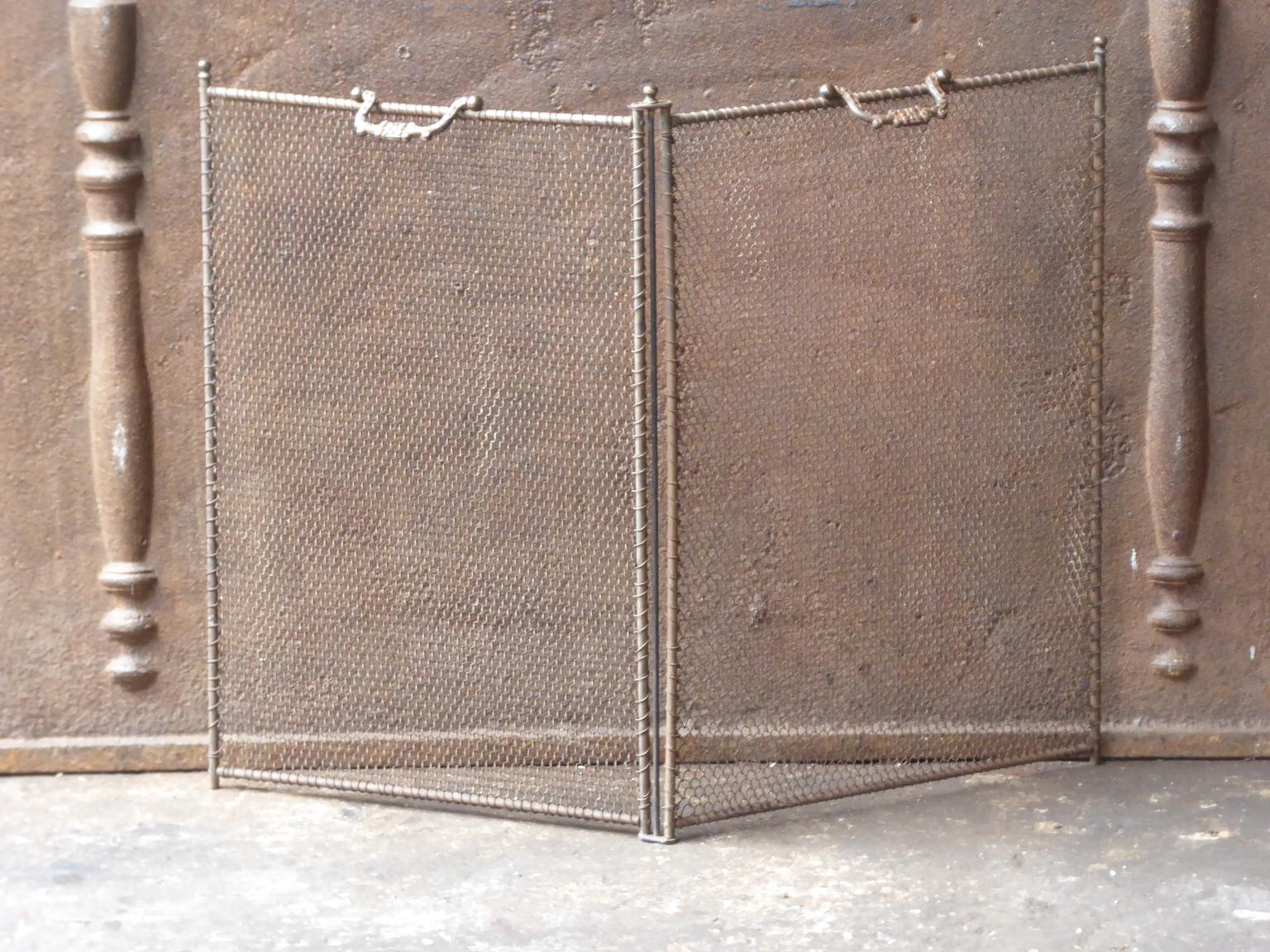 19th-early 20th century French Napoleon III two-panel fireplace screen. The screen is made of cast iron, iron and iron mesh. It is in a good condition and is fit for use in front of the fireplace.