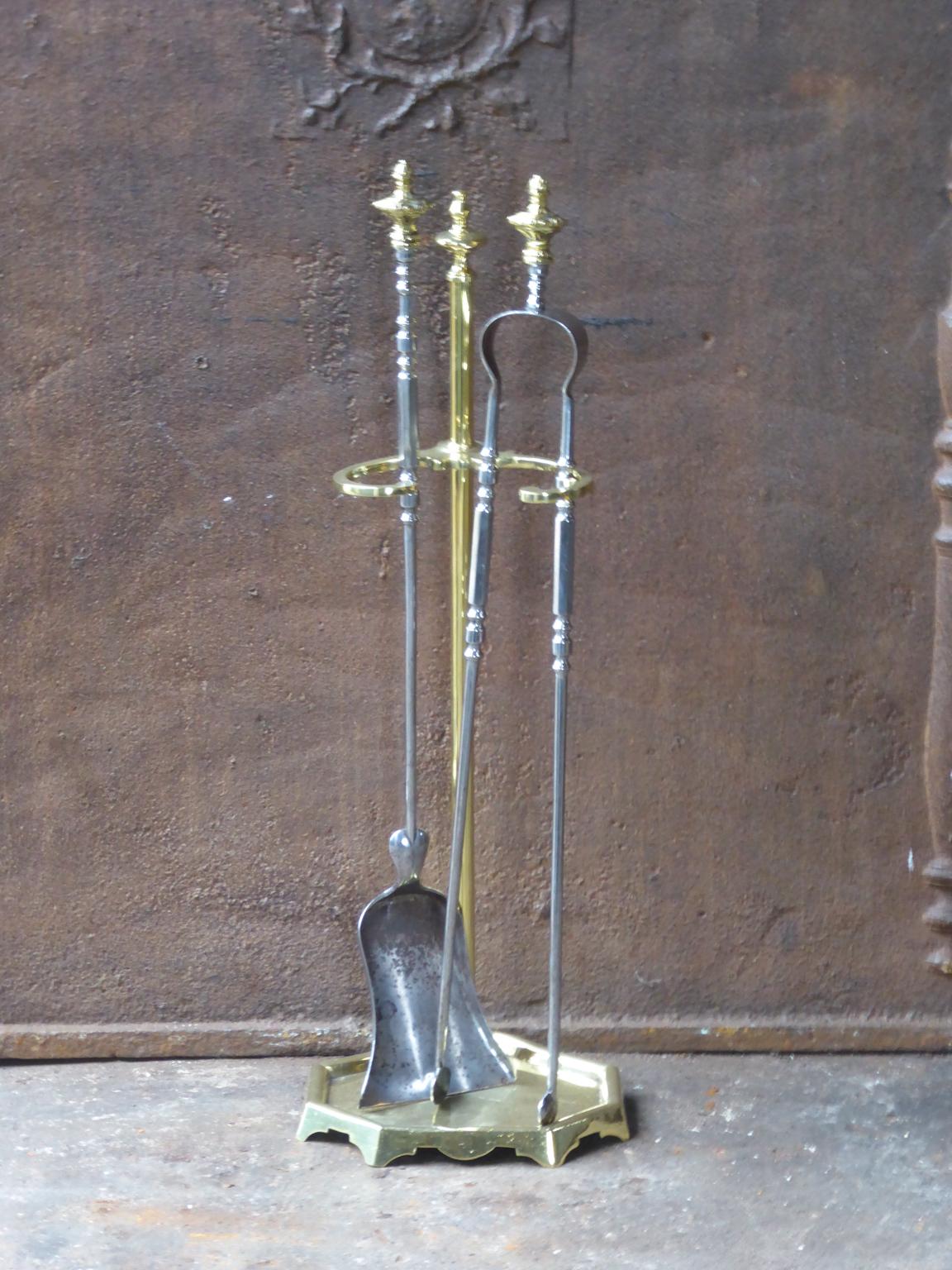 19th century French Napoleon III fireplace tool set made of polished brass and polished steel. The tool set consists of a stand and two fireplace tools.







               