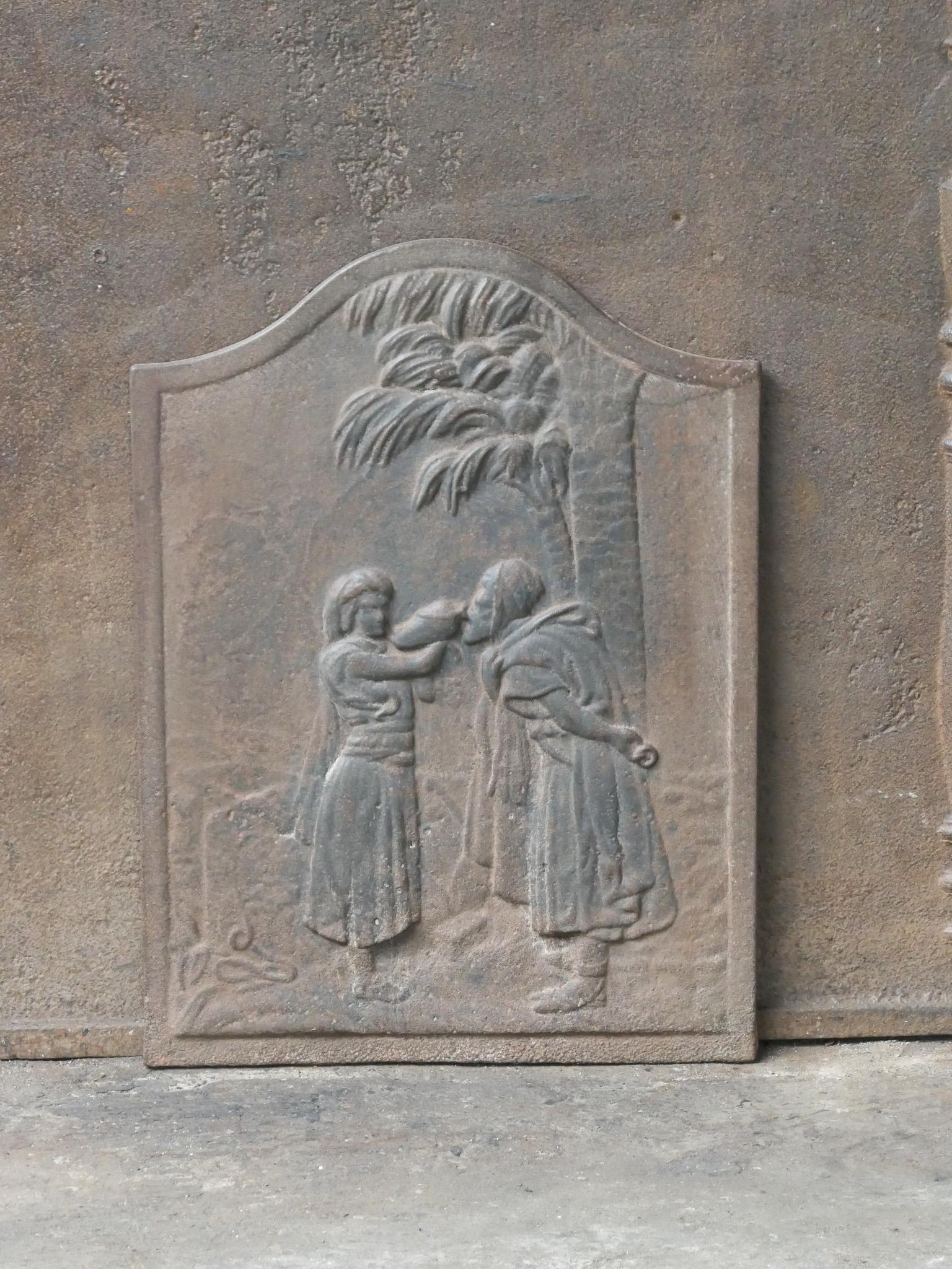 19th century French fireback with the parable of the good Samaritan. The style of the fireback is Napoleon III and it is from that period. 

The fireback is made of cast iron and has a natural brown patina. Upon request it can be made black / pewter