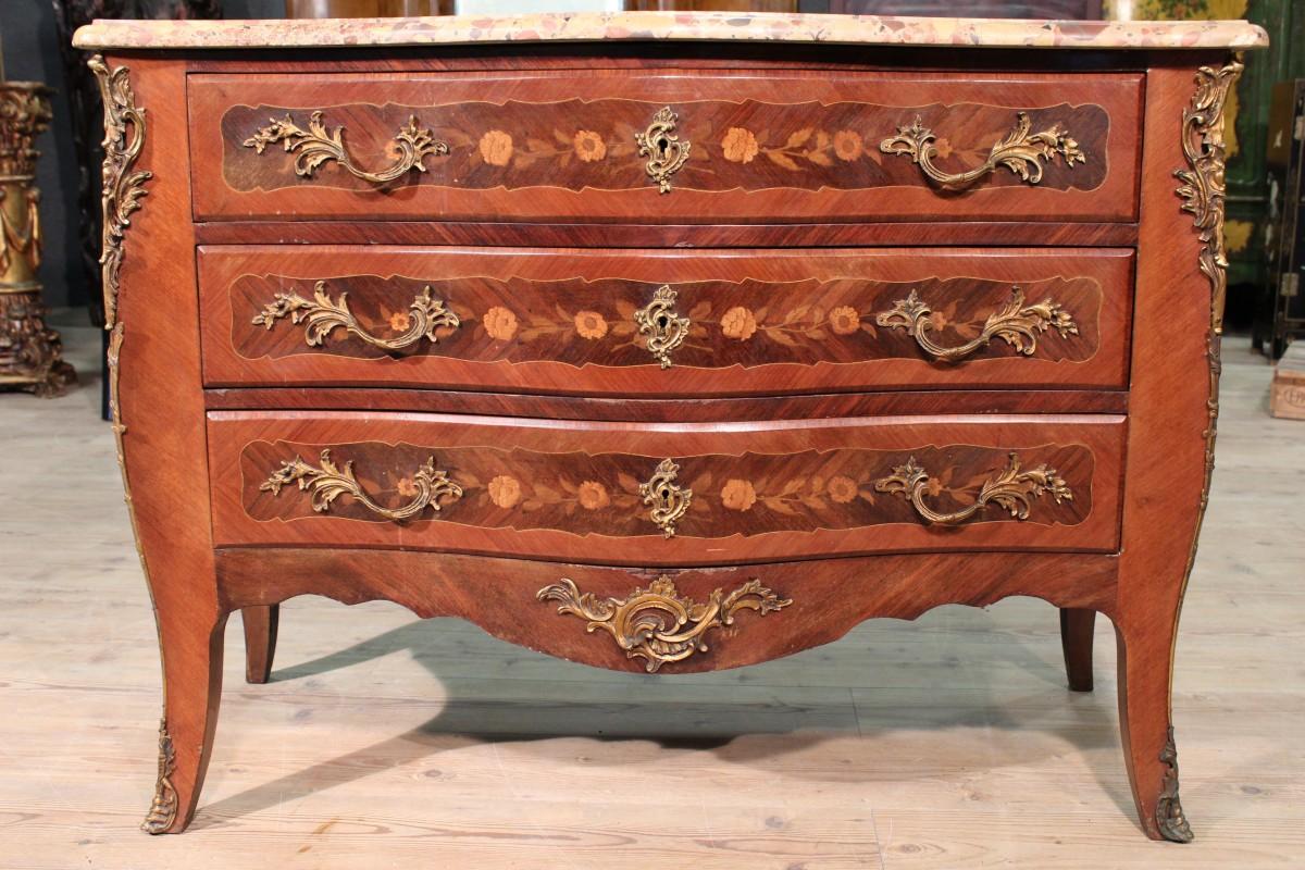 Antique French dresser Napoleon III. Chest of drawers inlaid with floral decorations in woods of
rosewood, bois de rose, boxwood, walnut and mahogany. Moved furniture rounded decorated with bronzes. Original plan in marble 