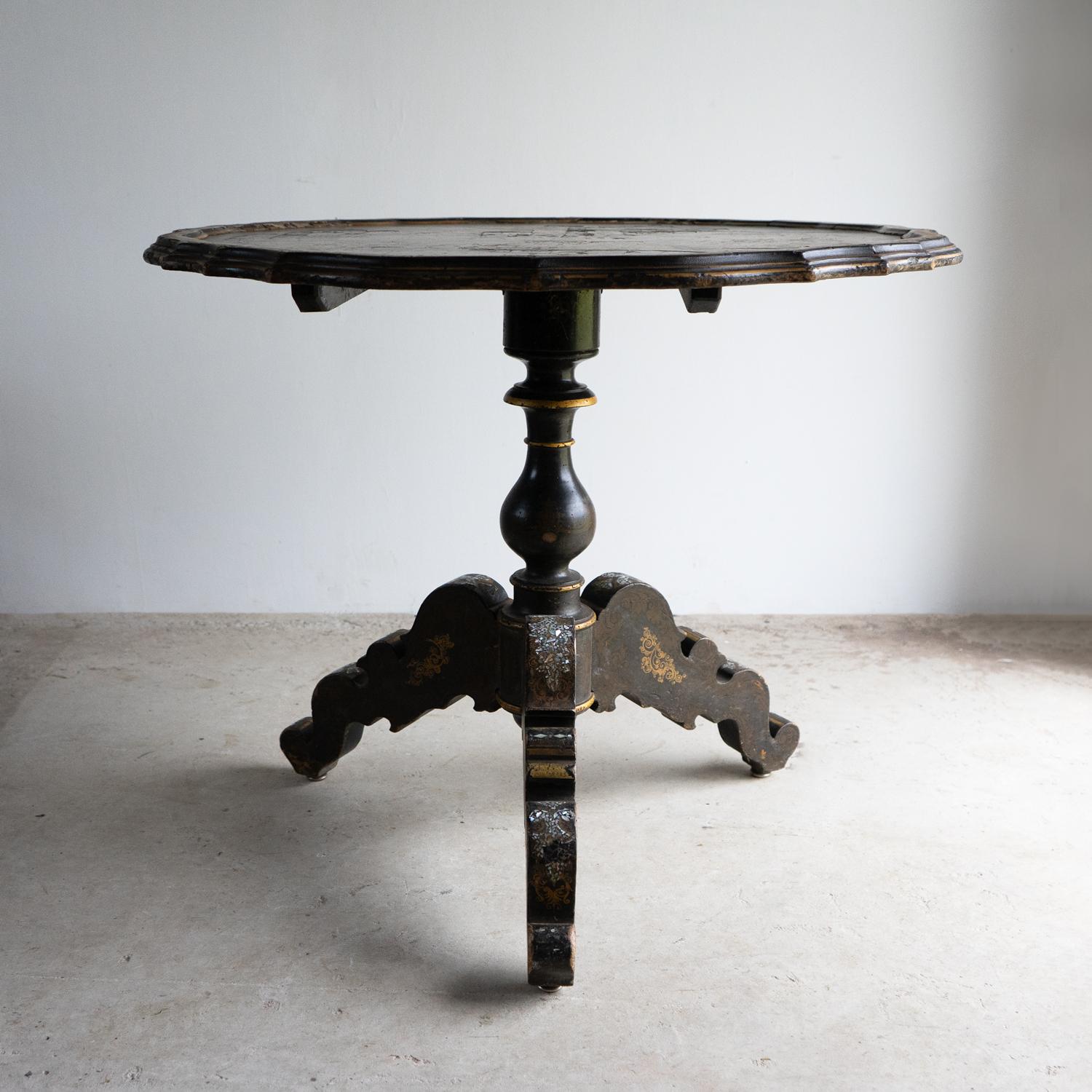 ANTIQUE EBONISED CIRCULAR TRIPOD TABLE

An extremely decorative and romantic table with a fine hand-painted Venetian scene depicting figures in a gondola on a canal with grand buildings behind.

The table is also inlaid with mother-of-pearl and