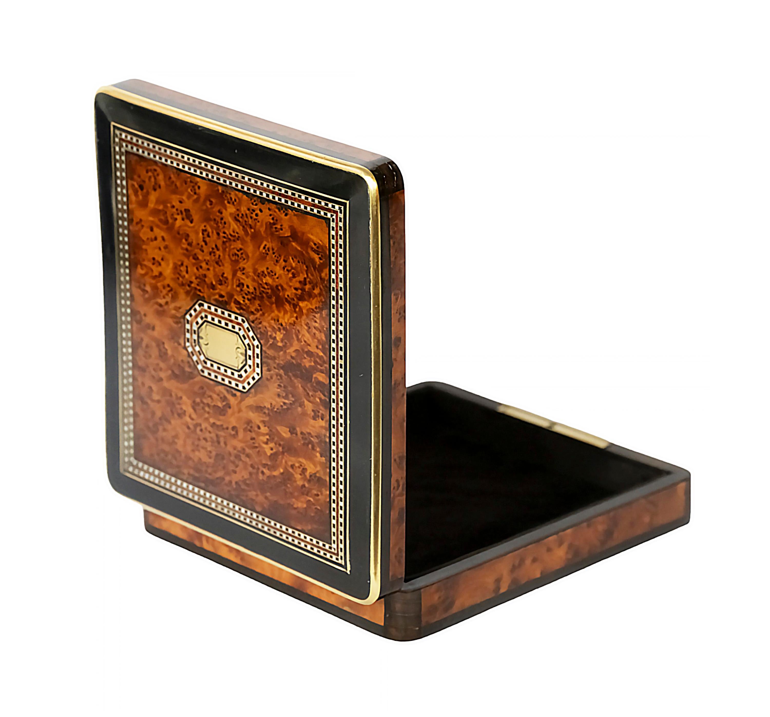 Antique 19th century French Napoleon III marquetry box.
The walnut burl wooden box is decorated with inlaid brass and mother of pearl with the new brown colour velour textile.
The key is included.
After high quality renovation.

 