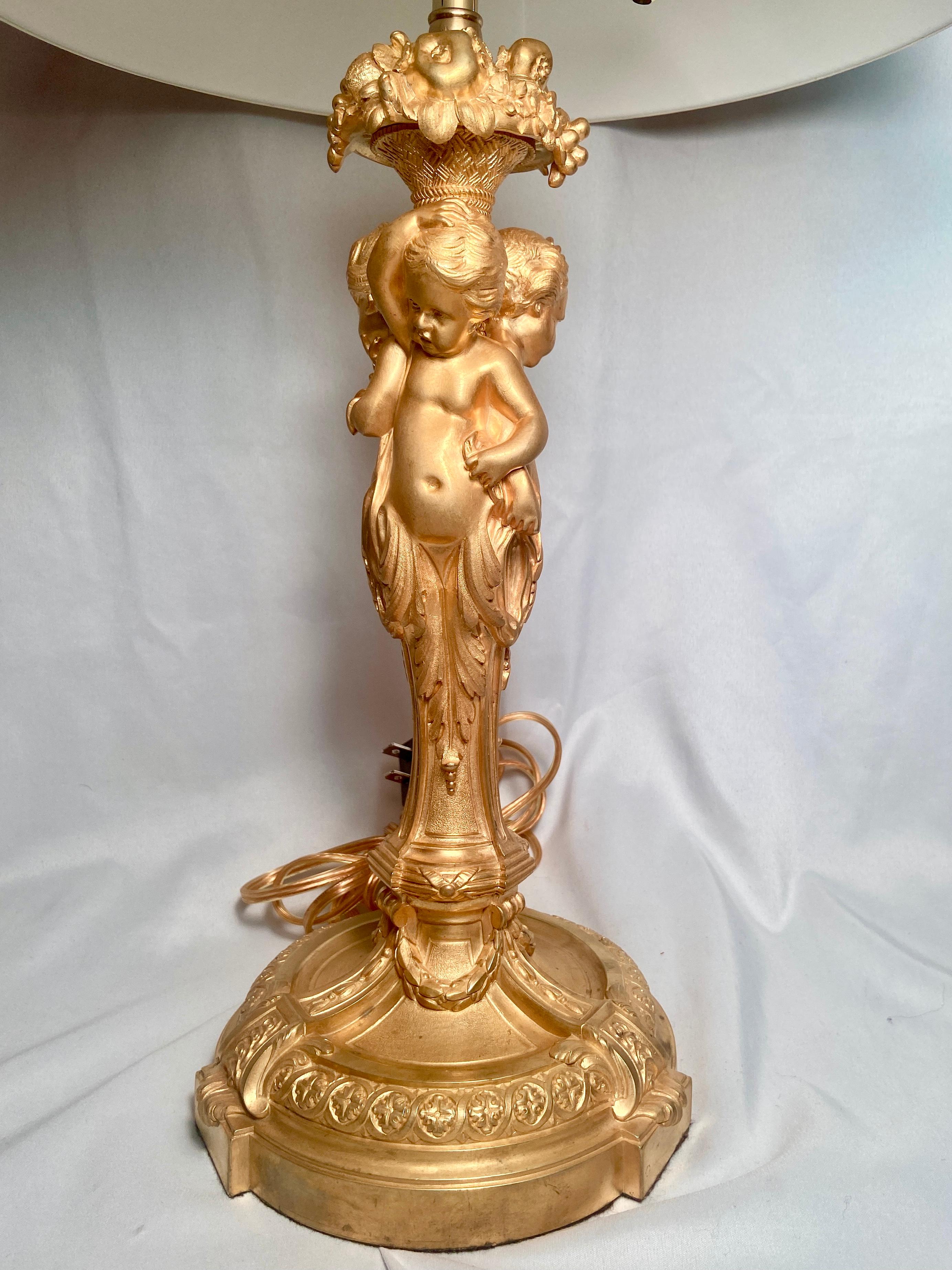 Antique French Napoleon III ormolu figural lamp with cherubs, Circa 1855-1875.