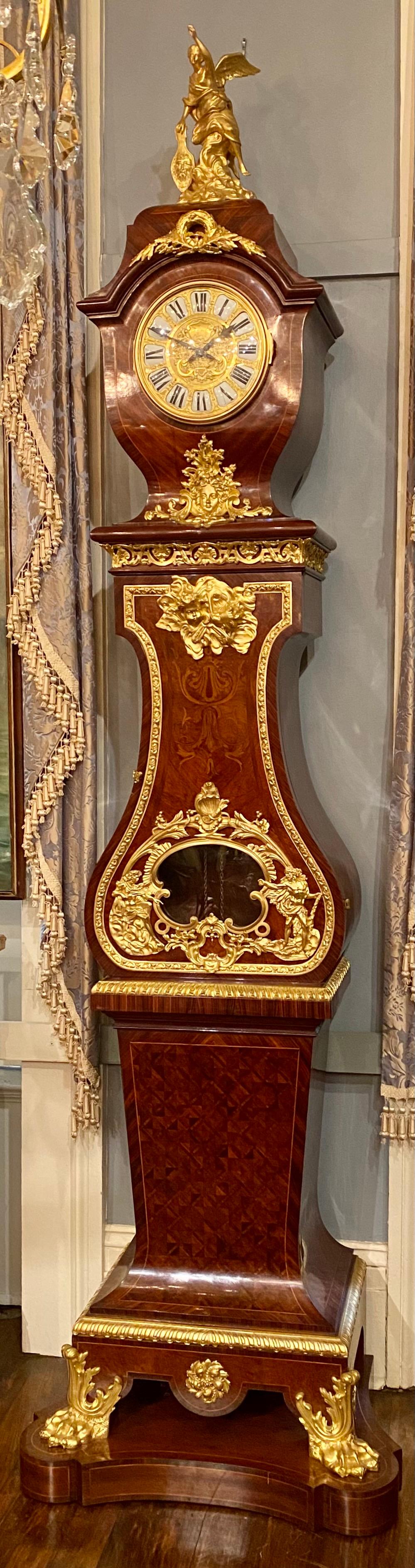 Antique French Napoleon III ormolu mounted mahogany grandfather clock Circa 1885-1890. This is a beautiful clock, with wonderful exotic wood inlays and ormolu finishings. It is in the Napoleon III style.