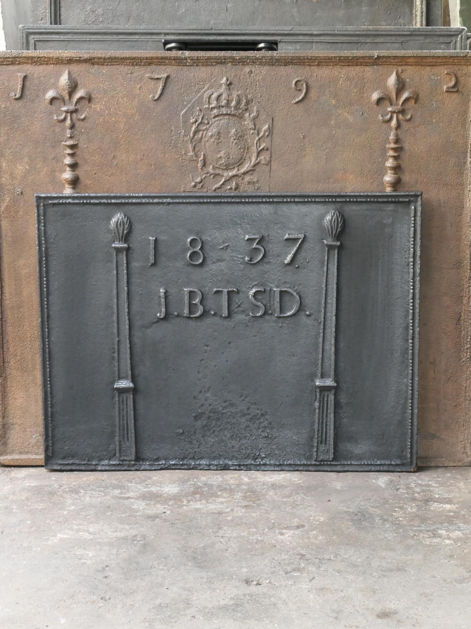 19th century French Napoleon III fireback with two pillars of freedom. The pillars symbolize the value liberty, one of the three values of the French revolution. The date of production, 1837, is also cast in the fireback as well as the initials of