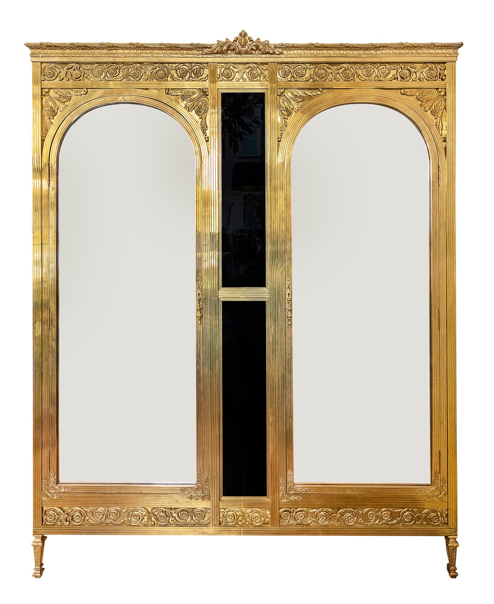 Antique French Napoleon III style wardrobe, circa 1900. 
All the construction and legs are made in bronze, sides with black colour glass, front doors with mirror in the arc shape facades.
The wardrobe is decorated with bronze elements.
Inside the