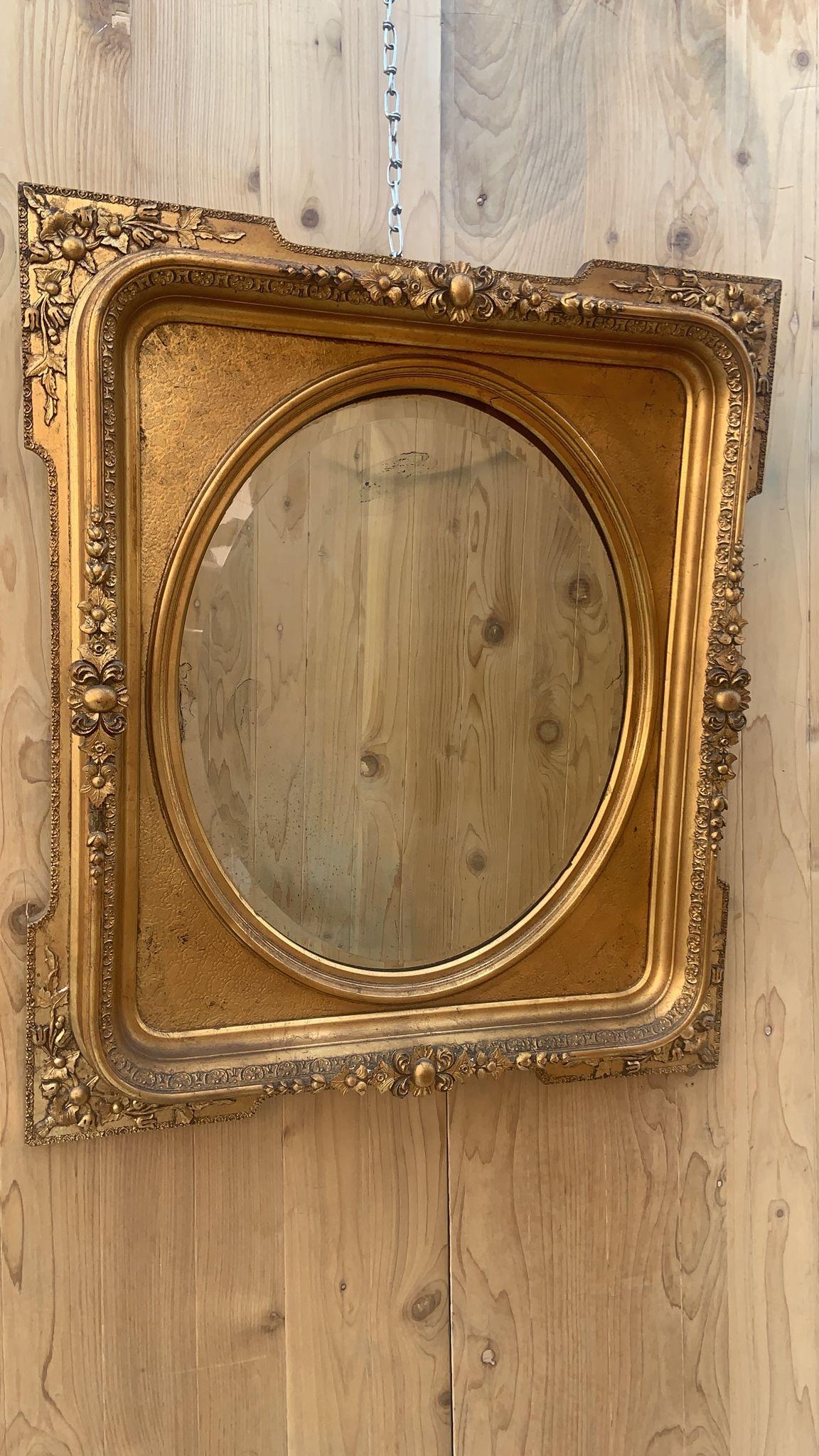 Antique French Napoleon III Style Carved and Gilded Beveled Framed Wall Mirror

Antique French Napoleon III Style Ornate Framed Wall Mirror. This hand carved mirror has beautiful details. Gold-Gilded Beveled Oval Wall Mirror Frame made in the 19th