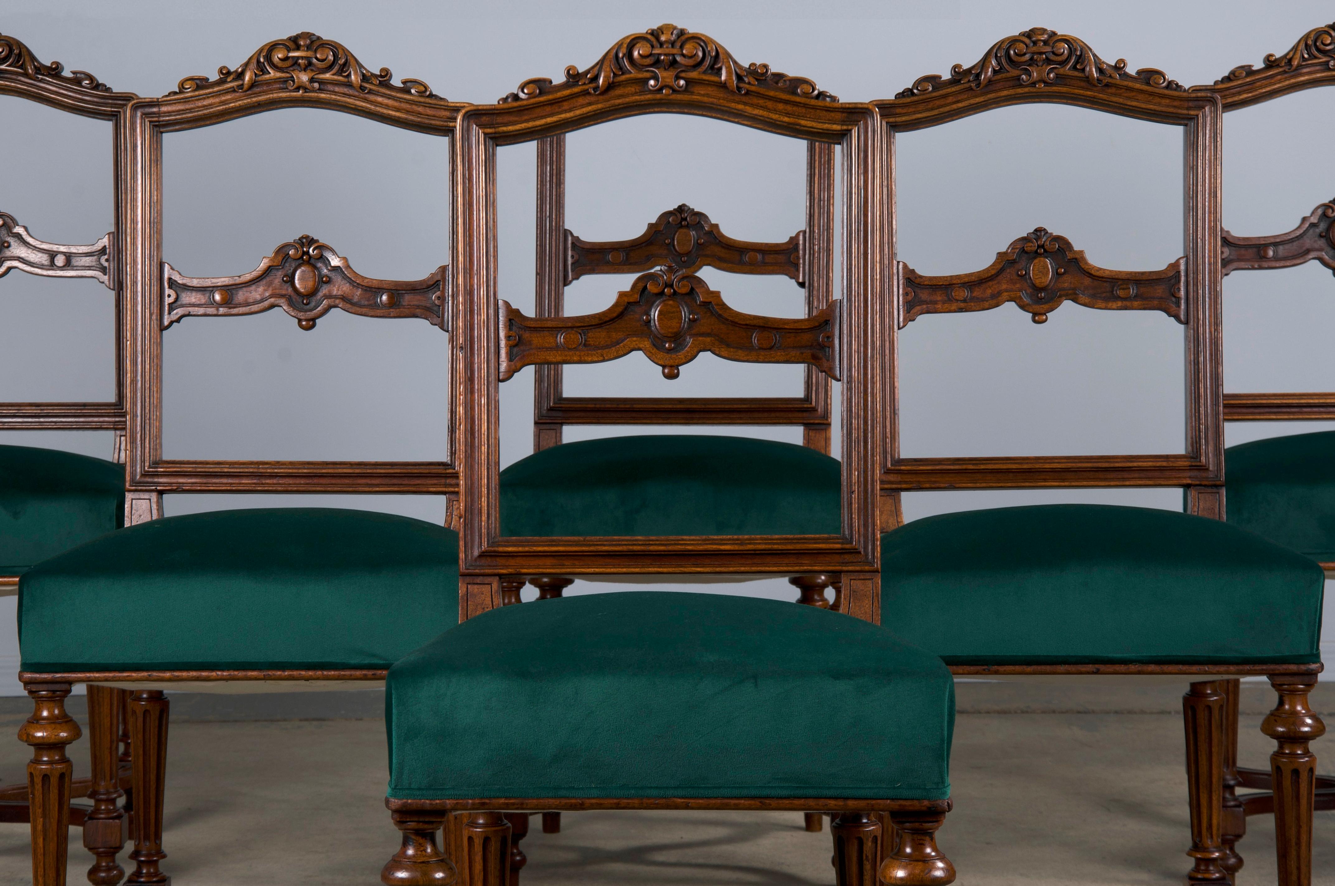An elegant set of six French dining chairs made in the style of Napoleon III, sourced from Provence, France. Beautifully hand-crafted from solid oak wood featuring a slat square-shaped back with a carved crown. The wood showcases a naturally aged