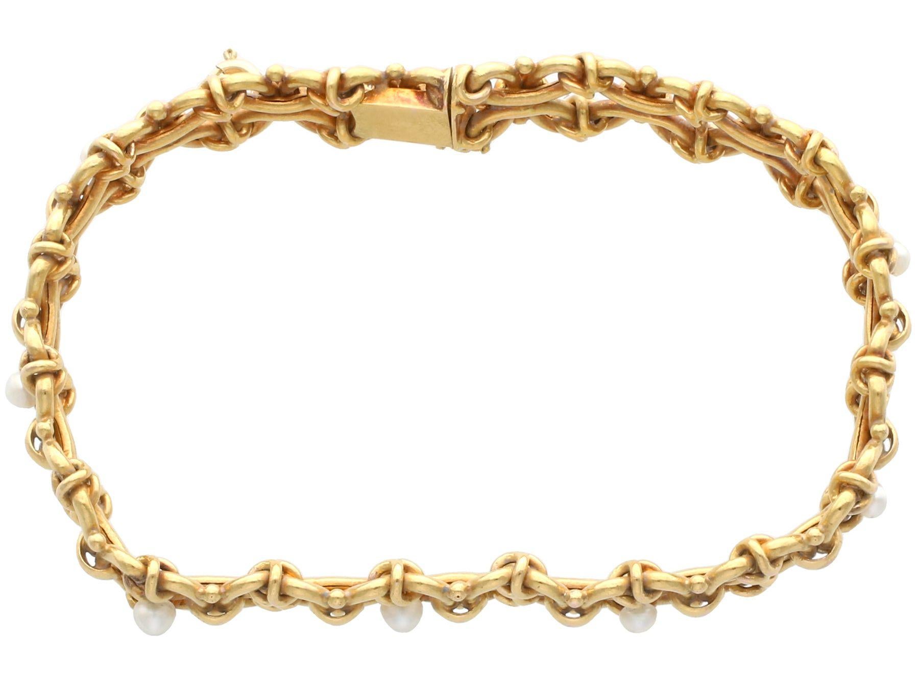 An impressive antique natural pearl and 18 karat yellow gold bracelet; part of our diverse antique jewelry and estate jewelry collections

This stunning antique Victorian bracelet has been crafted in 18k yellow gold.

The bracelet consists of