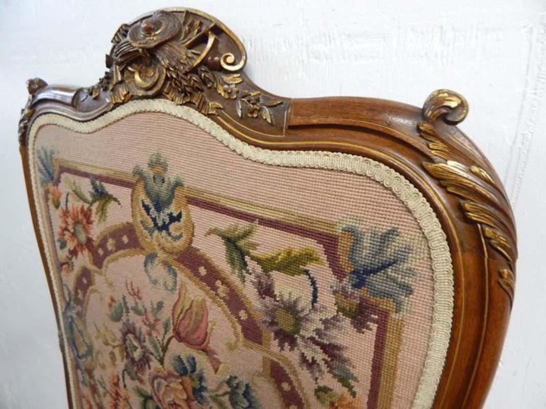 Antique French needlepoint panel in finely carved walnut frame, early 20th century.