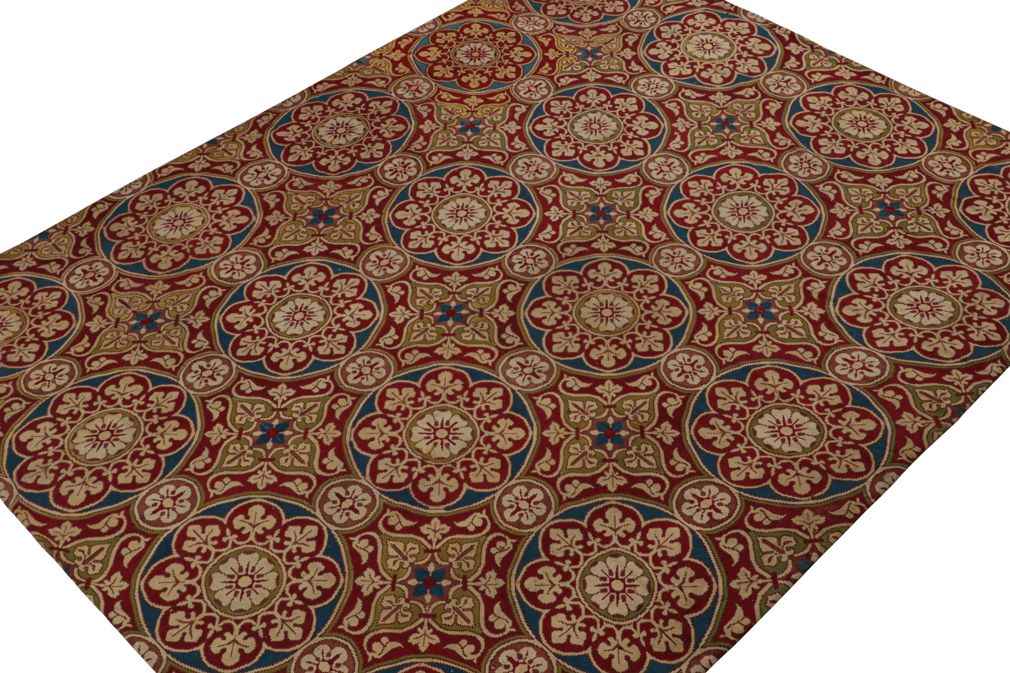 Handwoven in wool and originating from France circa 1920-1930, this 9x11 antique French Needlepoint rug features a red field and floral medallions in navy blue, chartreuse green and beige notes.

On the design: 

Needlepoints represent an intricate
