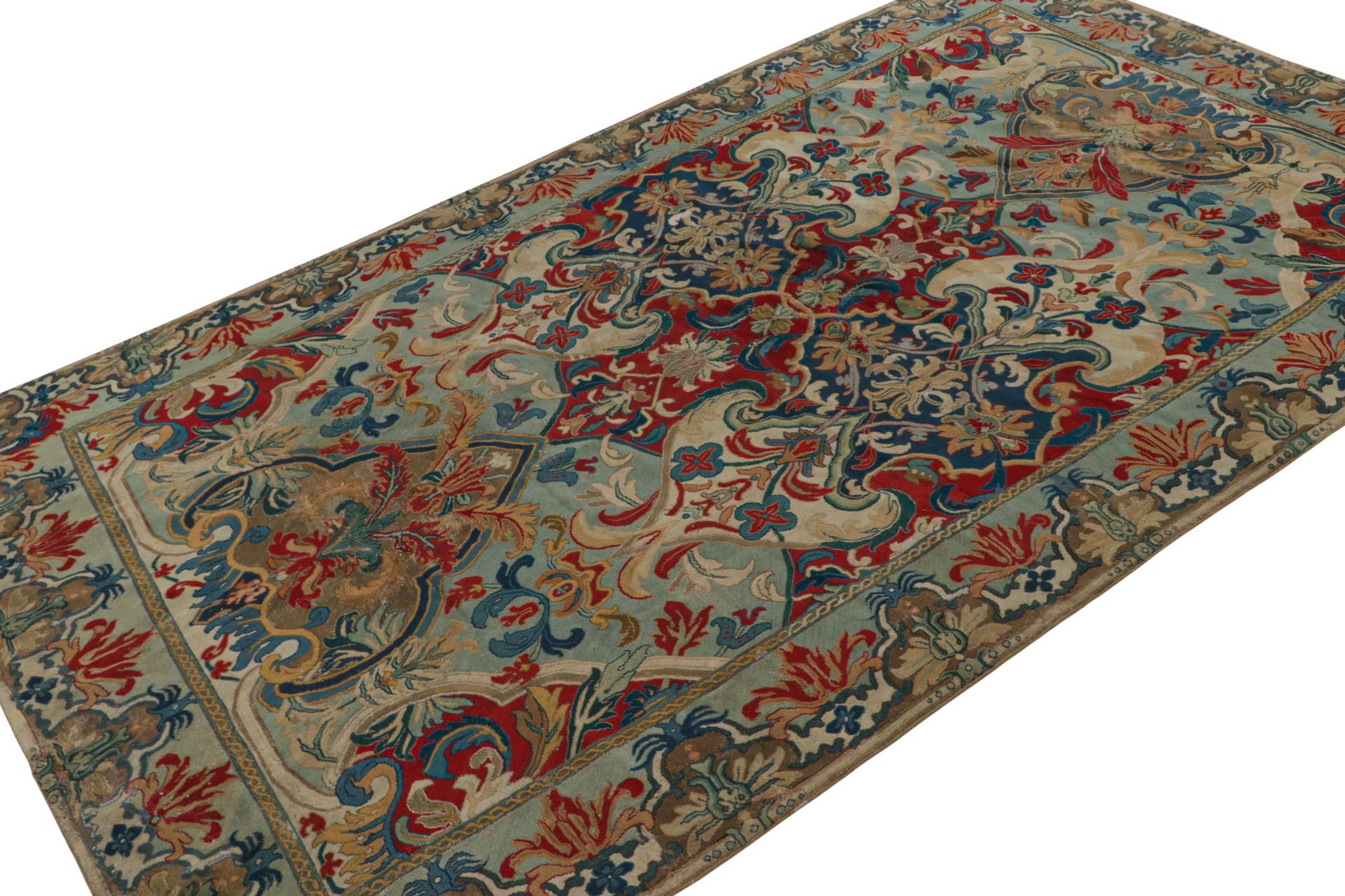Handmade in wool circa 1850-1860, this 5x9 antique French needlepoint rug is a particularly rare addition to our European rug collection. Its design features intricate medallions and florals in an all over pattern with notable blue, red and