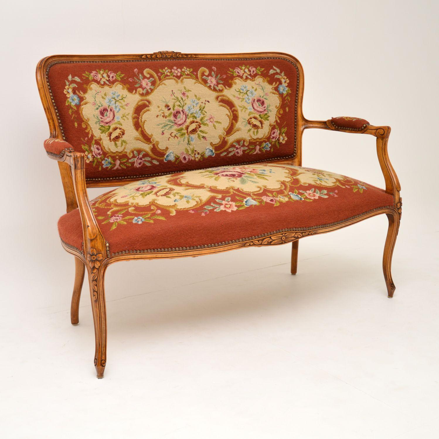 This antique French sofa is in excellent original condition and dates from circa 1890-1910 period.

What’s nice, is that it still has the original needlepoint fabric which is in very good condition. It has a sturdy solid walnut or beech frame with