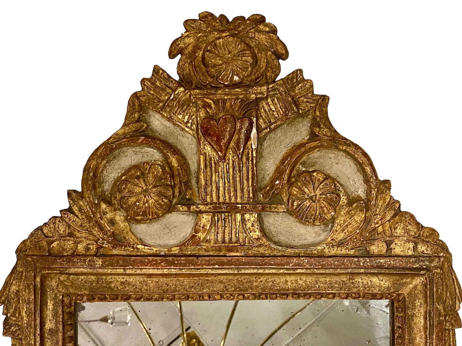 A circa late 19th century French gilt wood and painted mirror with original finish.

Measurements:
Total height: 28