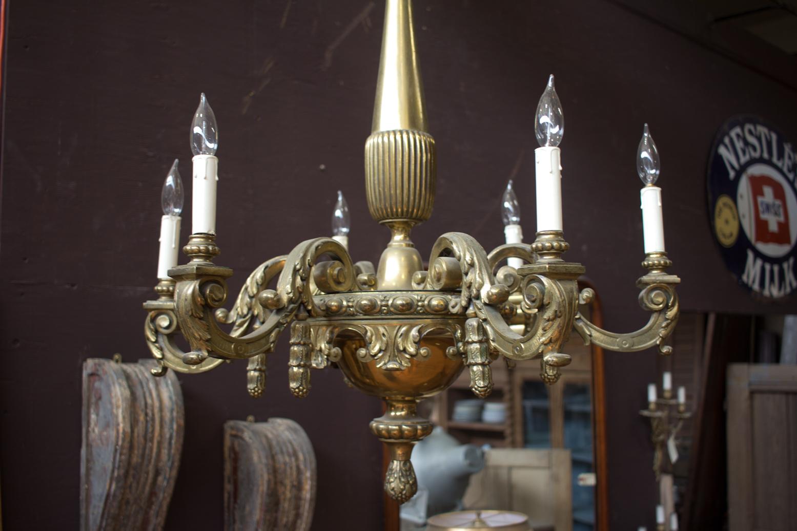 Beautiful and substantial antique neoclassical, solid brass six-arm chandelier (rewired). Exquisite scrolls and swags.