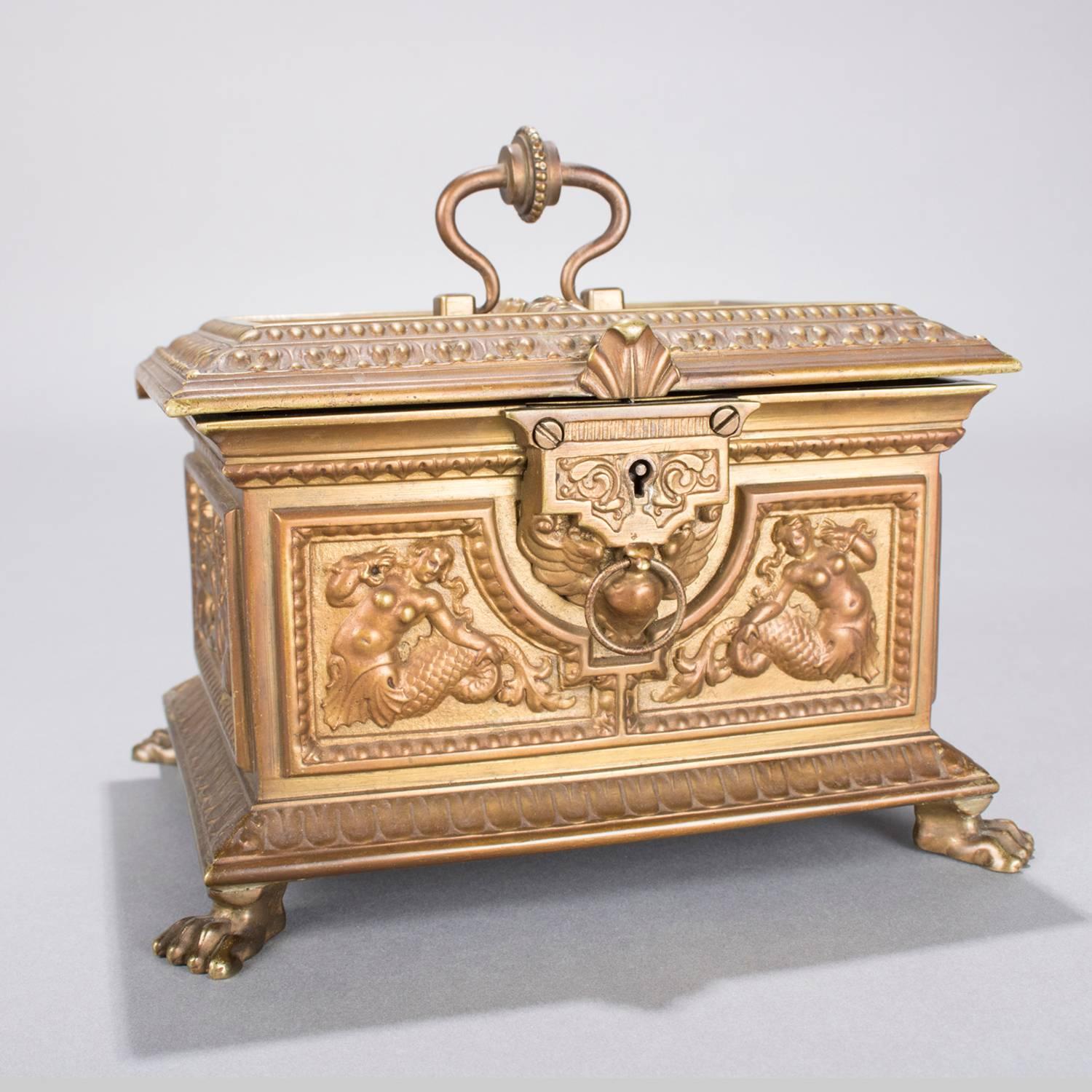 Antique French neoclassical jewelry casket (dresser box) is bronzed white metal with high relilef Greek Mythological creatures including Echidna (half woman and half-snake like creature), Cecrops and Wind God, beaded and tulip bordering; top is