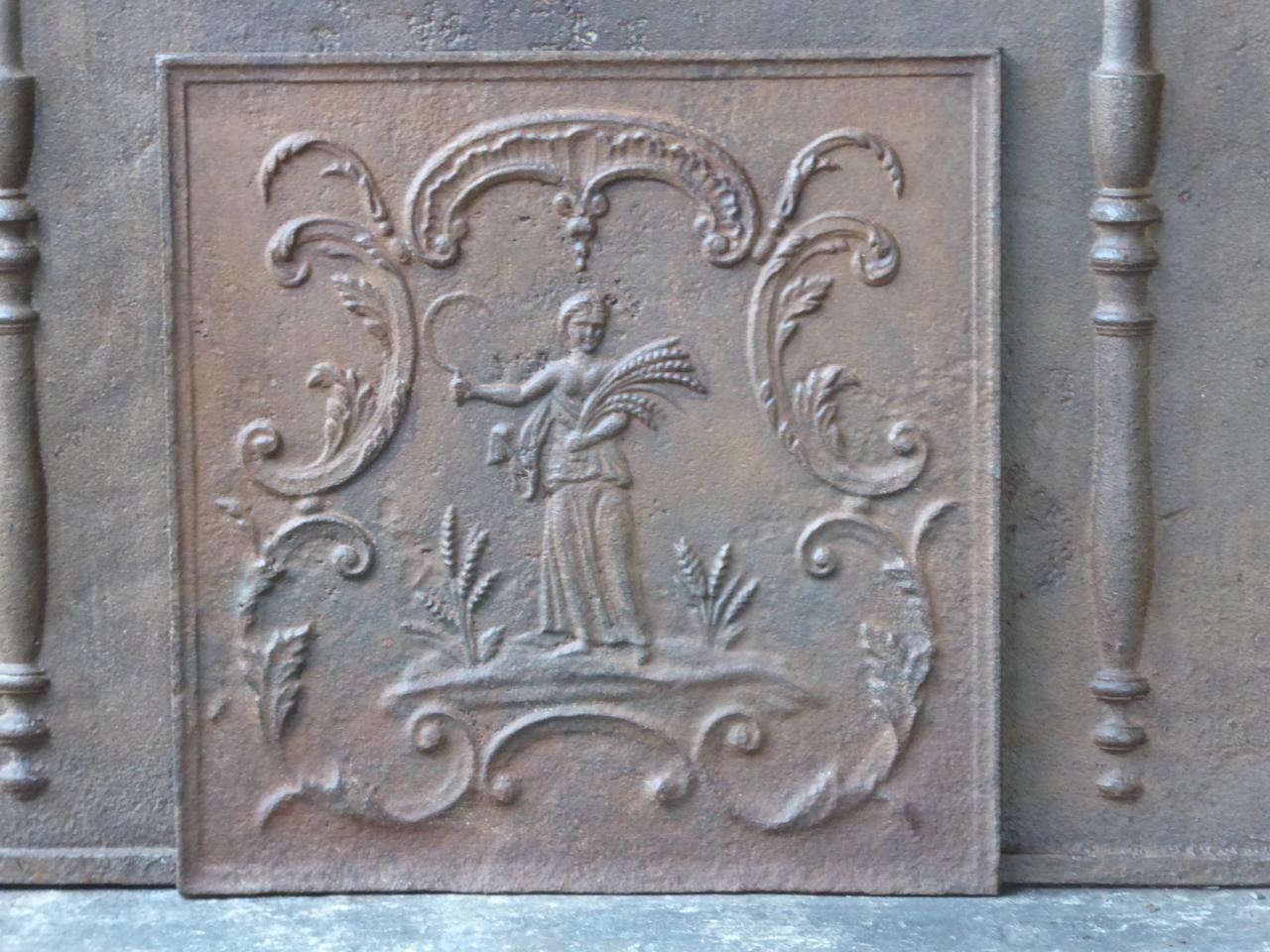 19th century French neoclassical fireback with the goddess Ceres. Goddess of agriculture (particularly grain) and the maternal love. The fireback has a natural brown patina. Upon request it can be made black.







 
