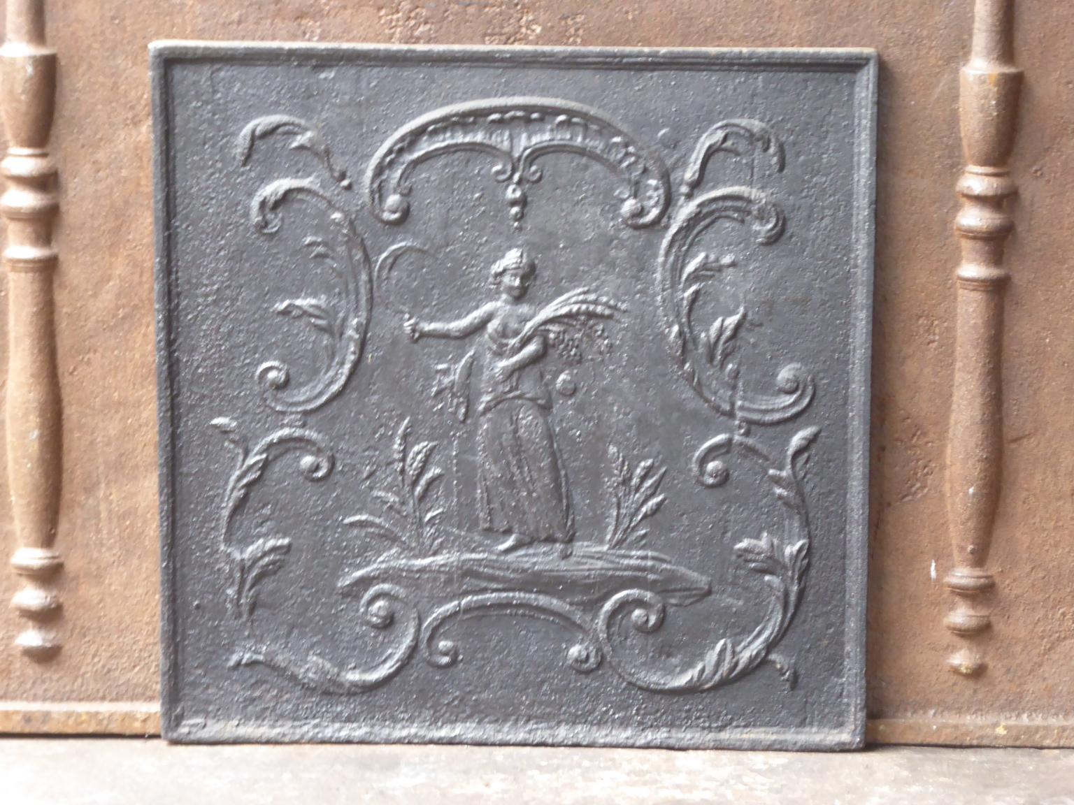 19th century French neoclassical fireback with the goddess Ceres. Goddess of agriculture (particularly grain) and the maternal love. 

The fireback has a black / pewter patina. It is in a good condition and does not have cracks.







    