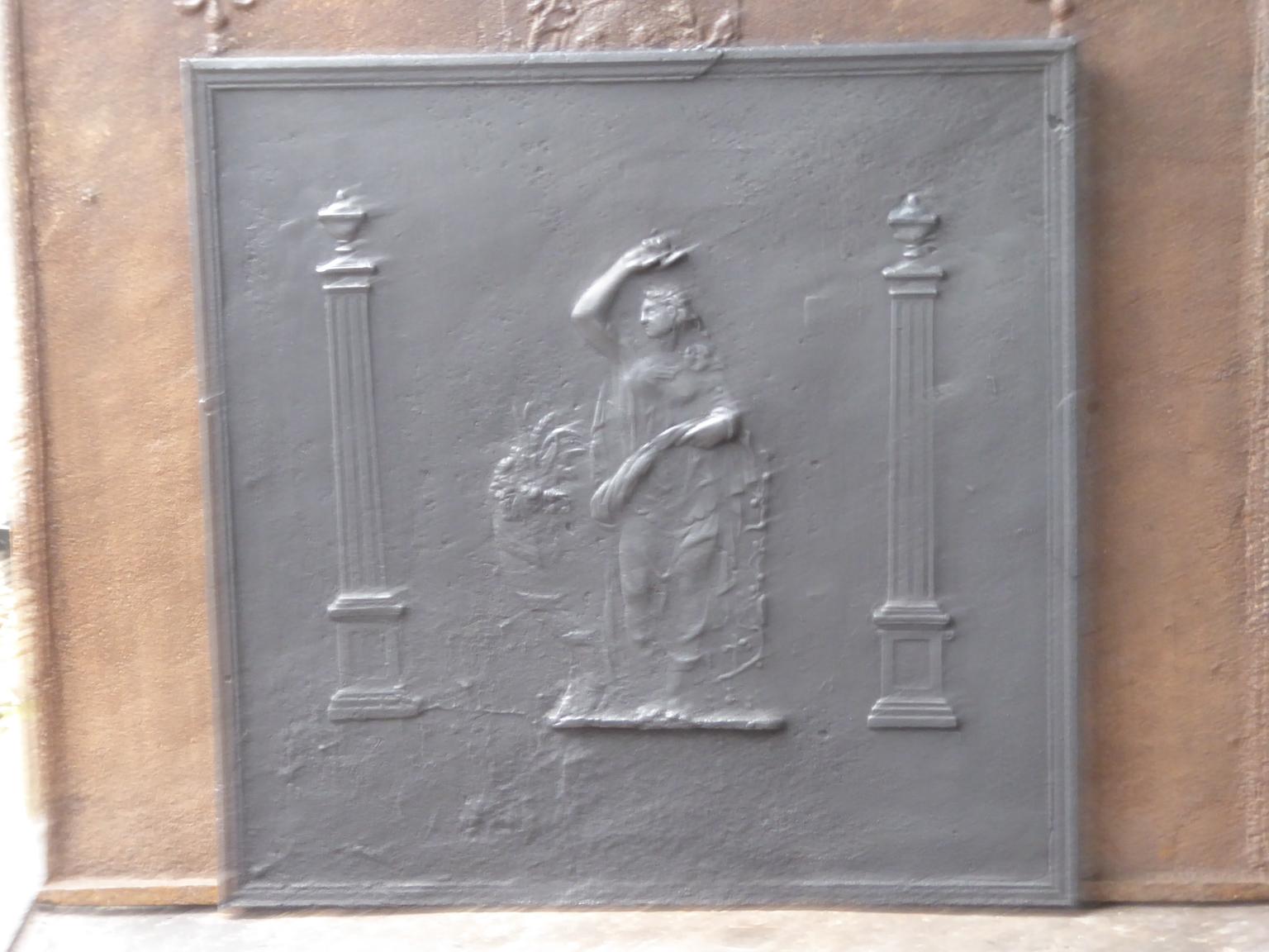 19th century French neoclassical fireback with the goddess Ceres. Goddess of agriculture (particularly grain) and the maternal love. Ceres is flanked by two pillars of liberty. They stand for one of the three values of the French Revolution.

The
