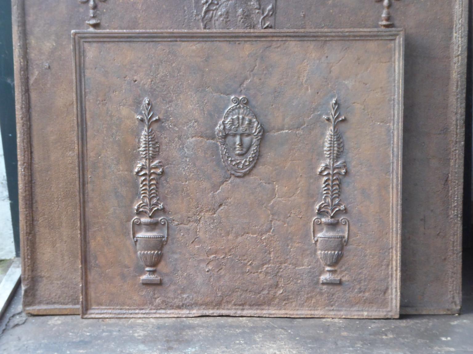 18th-19th century French neoclassical fireback with a typical neoclassical decoration.

The fireback is made of cast iron and has a natural brown patina. Upon request it can be made black or pewter. The fireback is in a good condition and does not