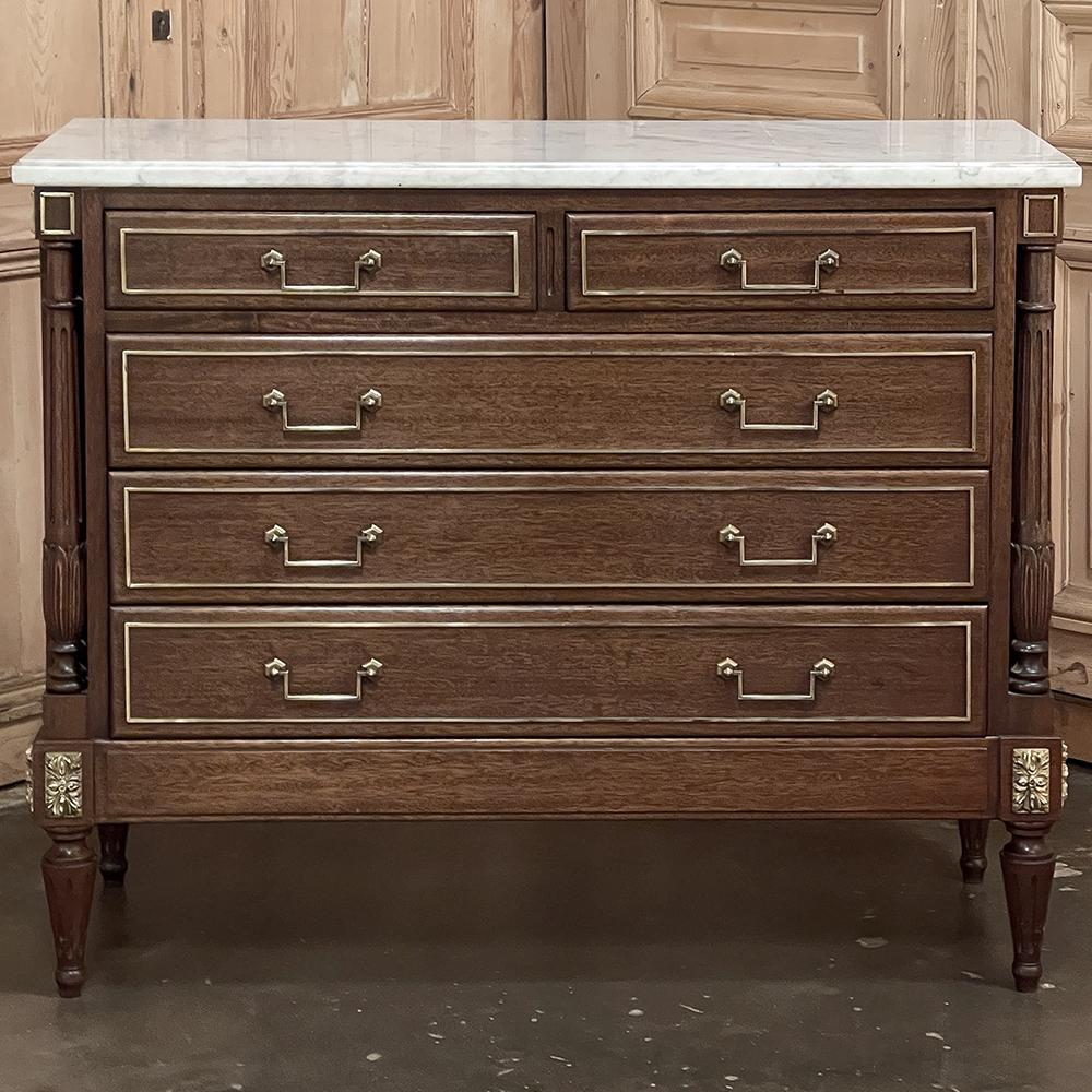 Antique French Neoclassical Directoire Commode with Carrara marble top is the perfect choice for blending with any classically-inspired decorating theme! With inspiration coming from the Maison Jansen style, it features tailored, rectilinear lines
