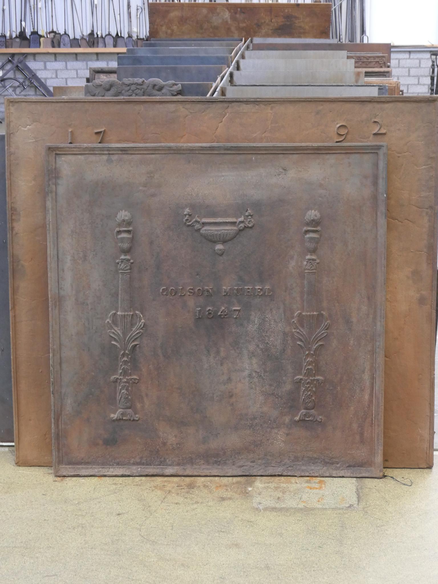 Late 18th or early 19th century French neoclassical period fireback.

The fireback is made of cast iron and has a brown patina. Upon request it can be made black / pewter with stove polish at no extra cost. 

Due to its weight this fireback will be