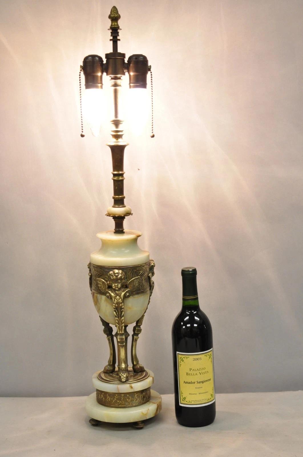 Antique French Neoclassical Louis XV Style Onyx Urn Figural Bronze Winged Cherub Table Lamp Raised on Paw Feet. Circa Late 19th Century. Measurements: 30