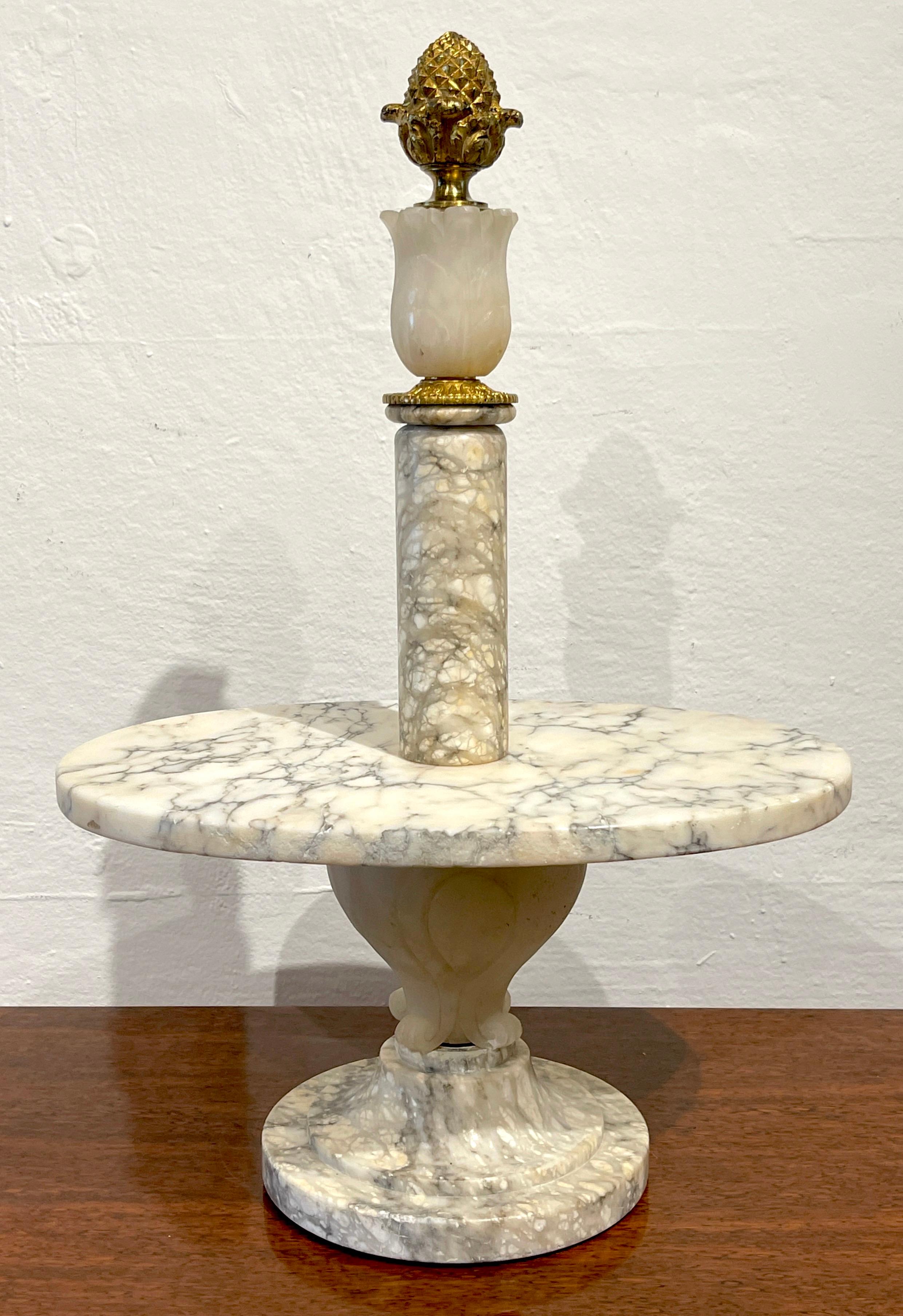 Antique French Neoclassical marble & Ormolu pastry Tazza 
France, Circa 1900s

Of substantial size, a rare find, by repute, the provenance is said to be from the famed French 'Stohrer Patisserie' Bakery. 
The top crowned with an ormolu acorn