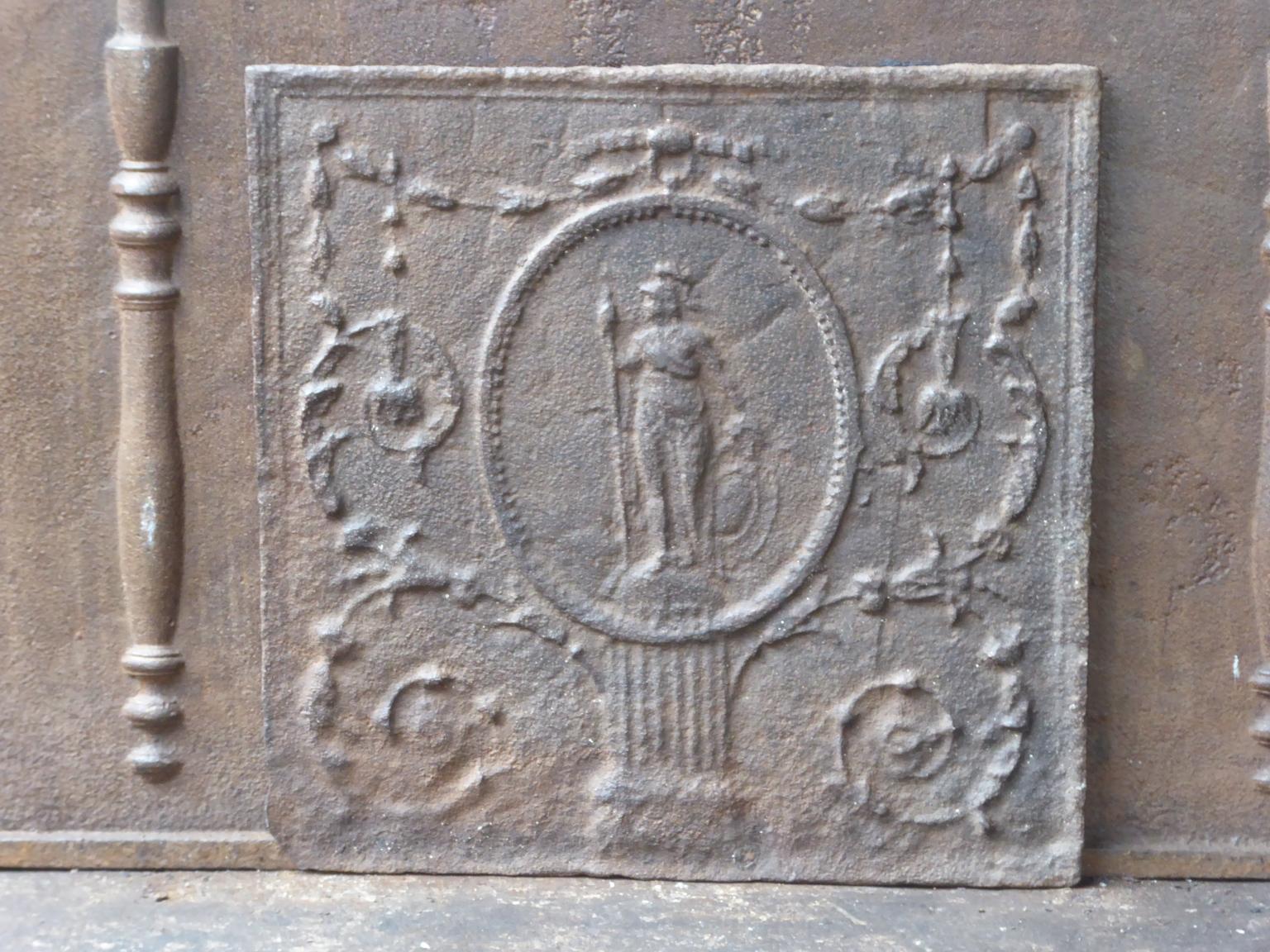 18th-19th century French Neoclassical fireback with the goddess Minerva. Goddess of knowledge, intellect and ingenuity of the human spirit. She is often depicted with an owl, symbol of wisdom. 

The fireback has a natural brown patina. Upon