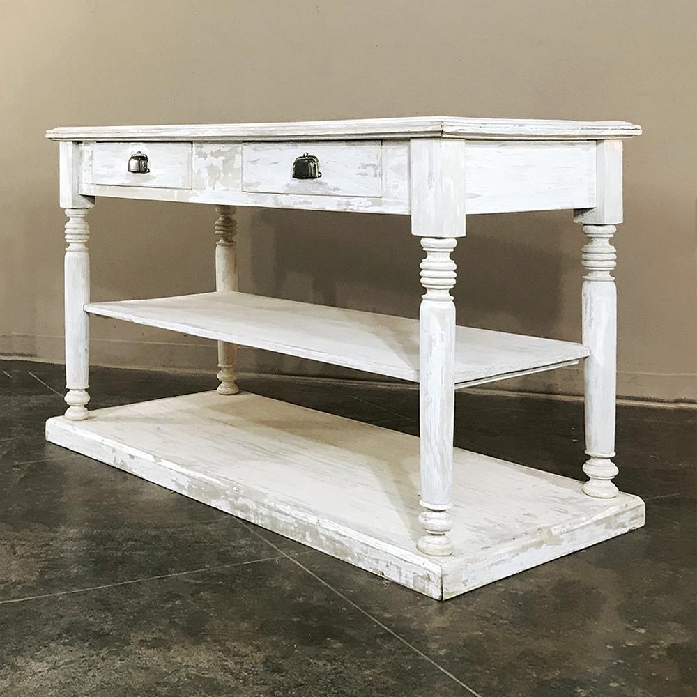 Antique French neoclassical painted store counter, island, sideboard is a great choice for any room! Casual, tailored lines include three surfaces supported by turned columns, with two convenient drawers as well. Finished on all four sides it will