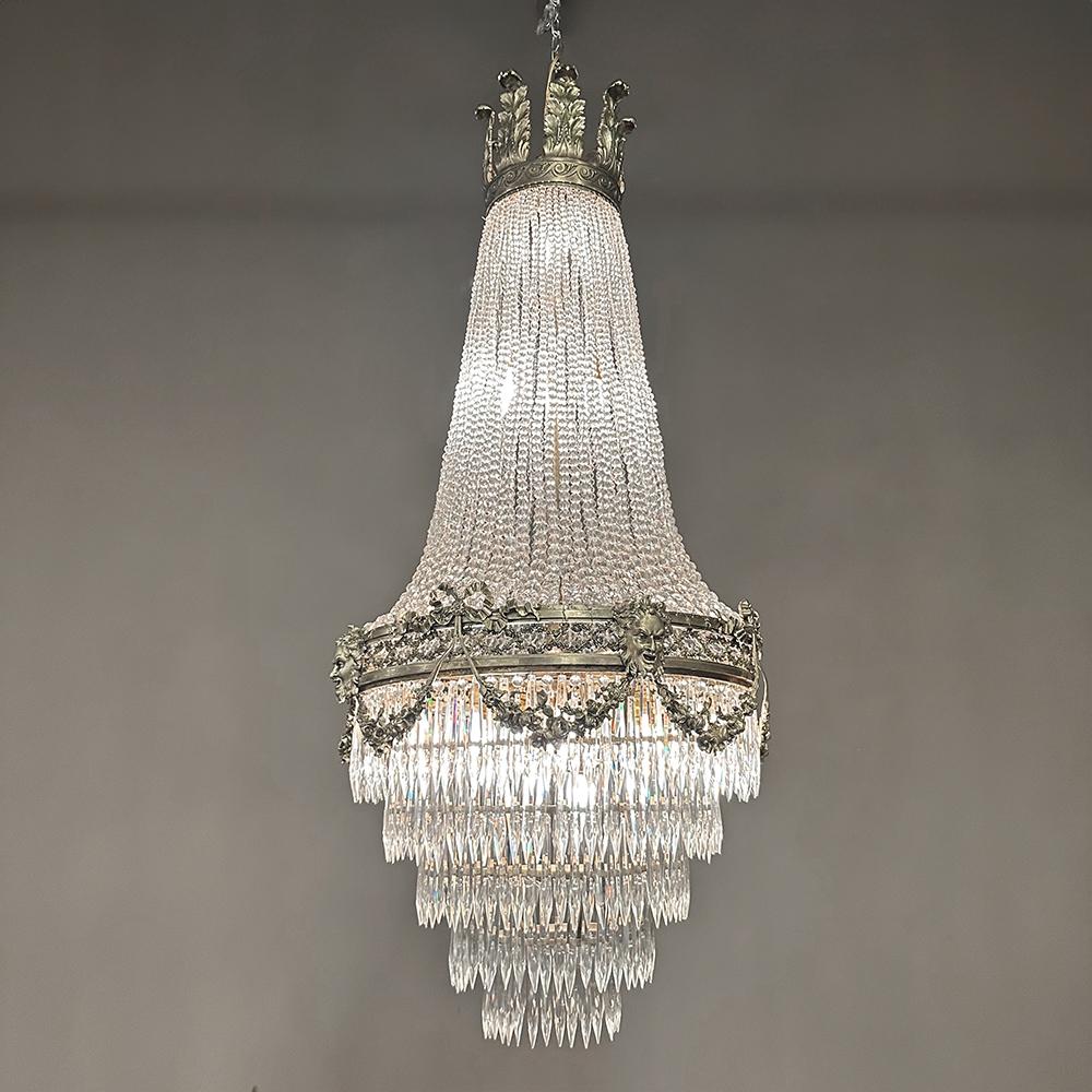 Antique French Neoclassical Sack of Pearls Bronze & Crystal Chandelier with Bacchus is one of the most spectacular lighting fixtures we've had the pleasure of offering!  Combining bronze with a gilt finish and various sizes and styles of cut