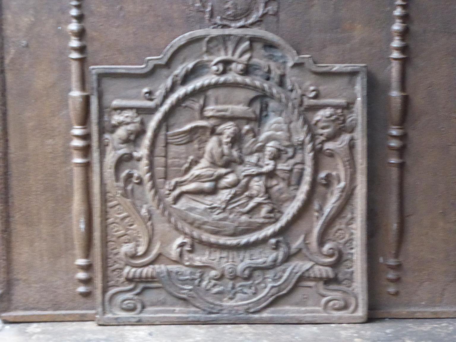 18th-19th century French neoclassical fireback with an allegory on the Winter. The Winter is represented by an old man warming his hands.

The fireback is made of cast iron and has a natural brown patina. Upon request it can be made black /