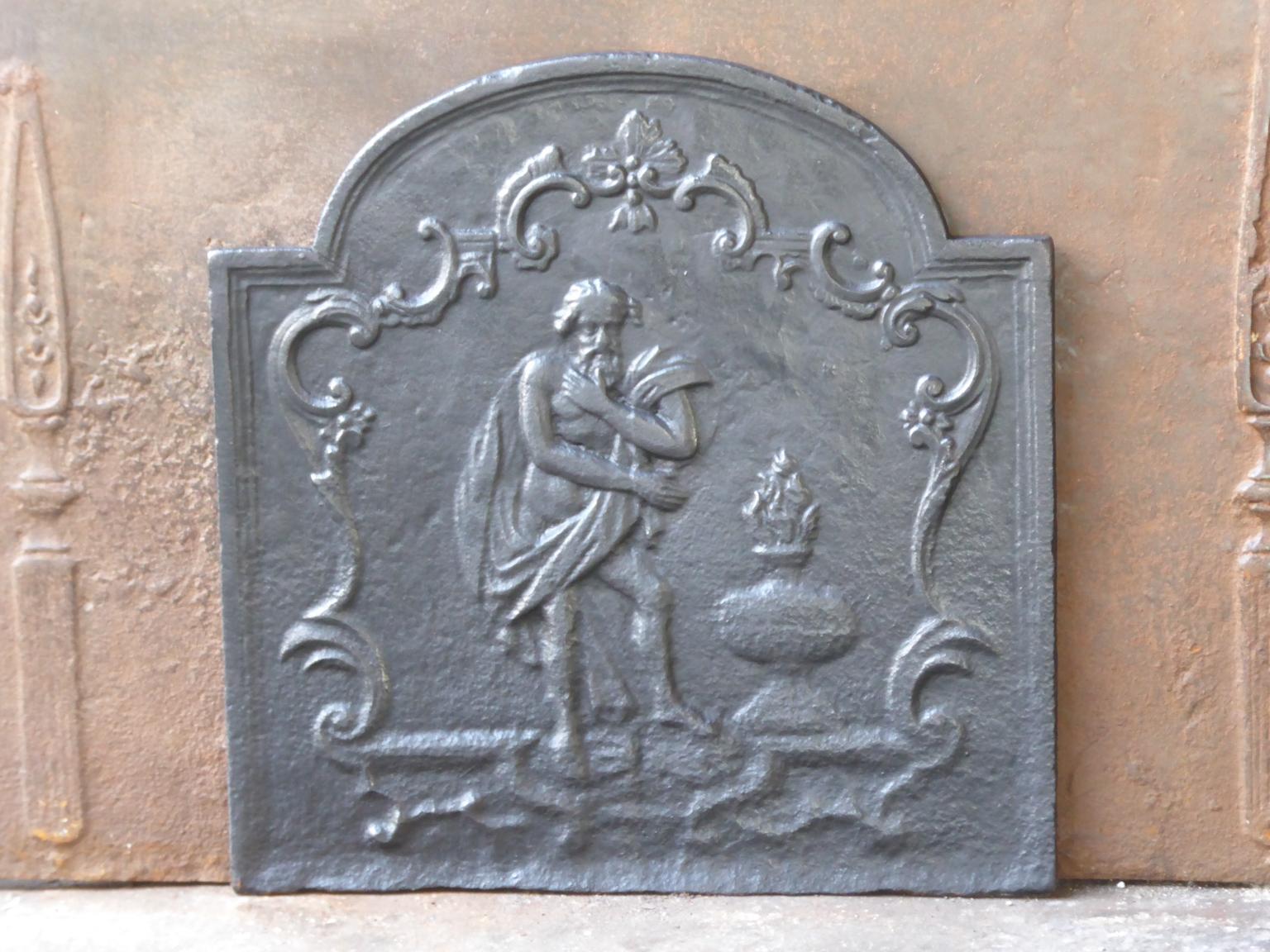 Late 18th or early 19th century French neoclassical fireback with an allegory on the Winter. The Winter is represented by an old man warming his hands.

The fireback is made of cast iron and has a black / pewter patina.







 