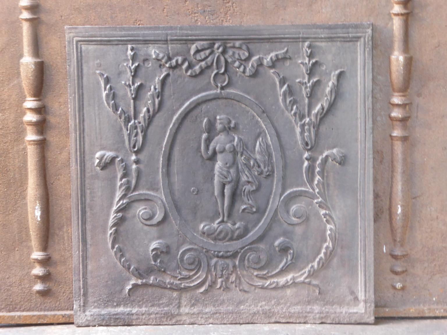 19th century French fireback with Venus. Venus with her ??mirror and torch of Hestia. Goddess of love, beauty and fertility. The torch is the symbol of Hestia, goddess of fire and more specifically the domestic hearth. Where no fire is found, a
