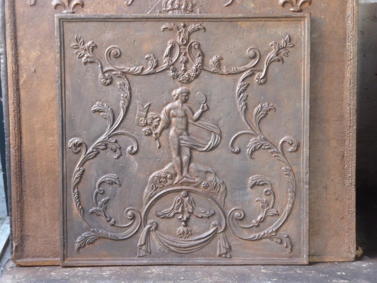 Late 18th or early 19th century French fire back with Venus. Venus with her mirror and torch of Hestia. Goddess of love, beauty and fertility. The torch is the symbol of Hestia, goddess of fire and more specifically the domestic hearth. Where no