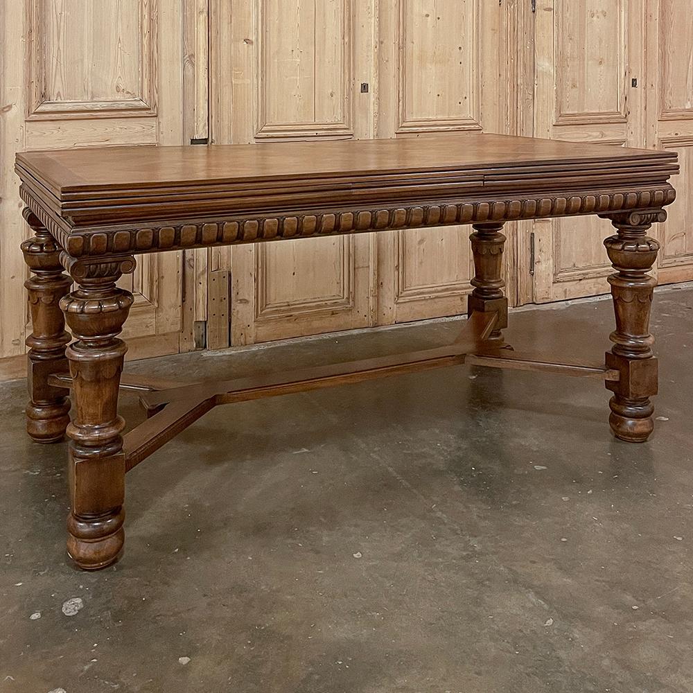 Antique French Neoclassical Walnut Draw Leaf Banquet Table will create a truly timeless elegance for your dining experience!  Crafted from sumptuous French walnut, it features a spacious size that easily accommodates 6 with room to spare, and with