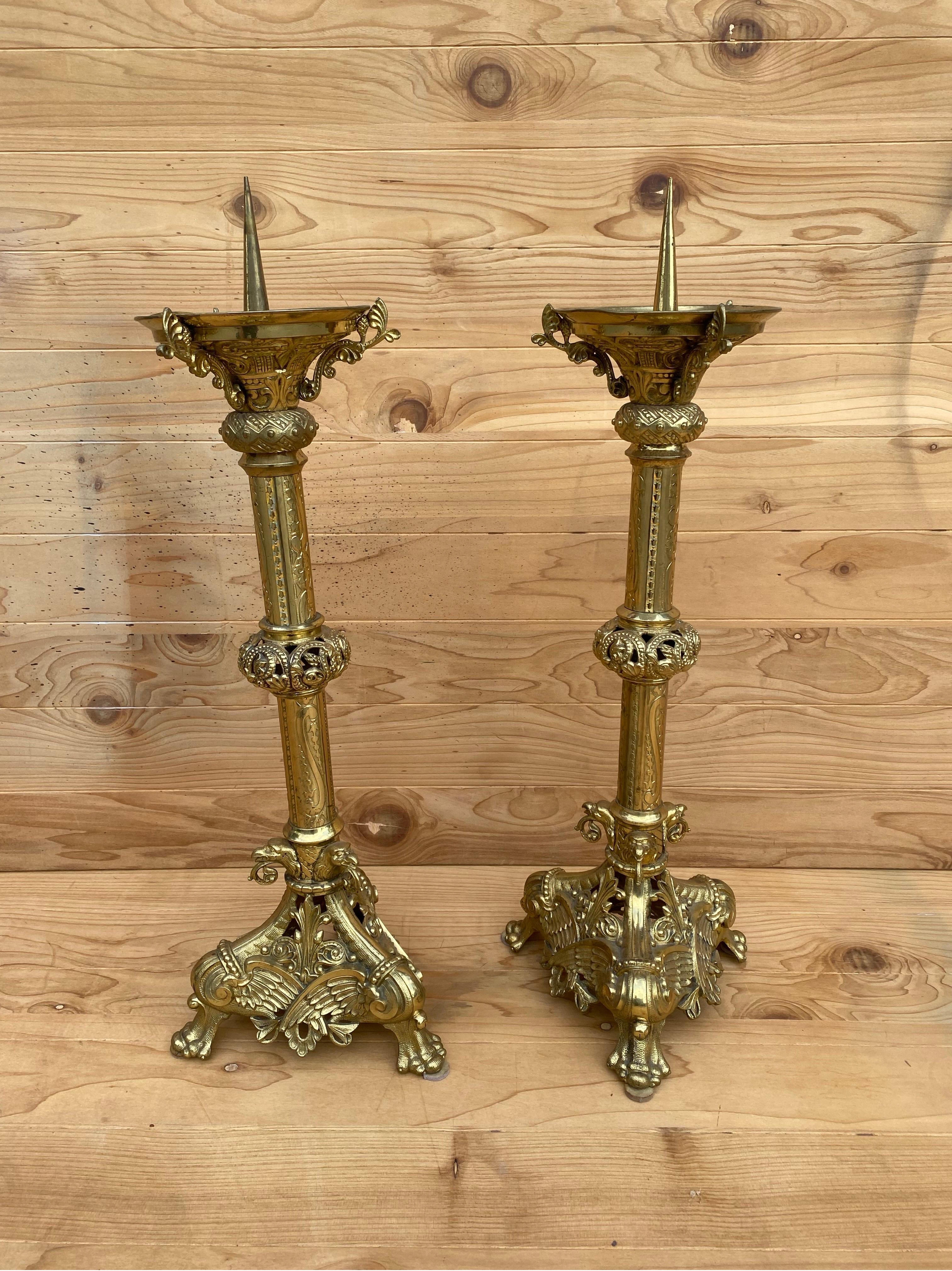 Antique French Ornate Gilt Bronze Ormolu Pricket Candlesticks - Pair

This rare matching set of antique solid brass handcrafted candle holders rest on triangular shaped base with lion paw feet. The entire body of the candlesticks are decorated with