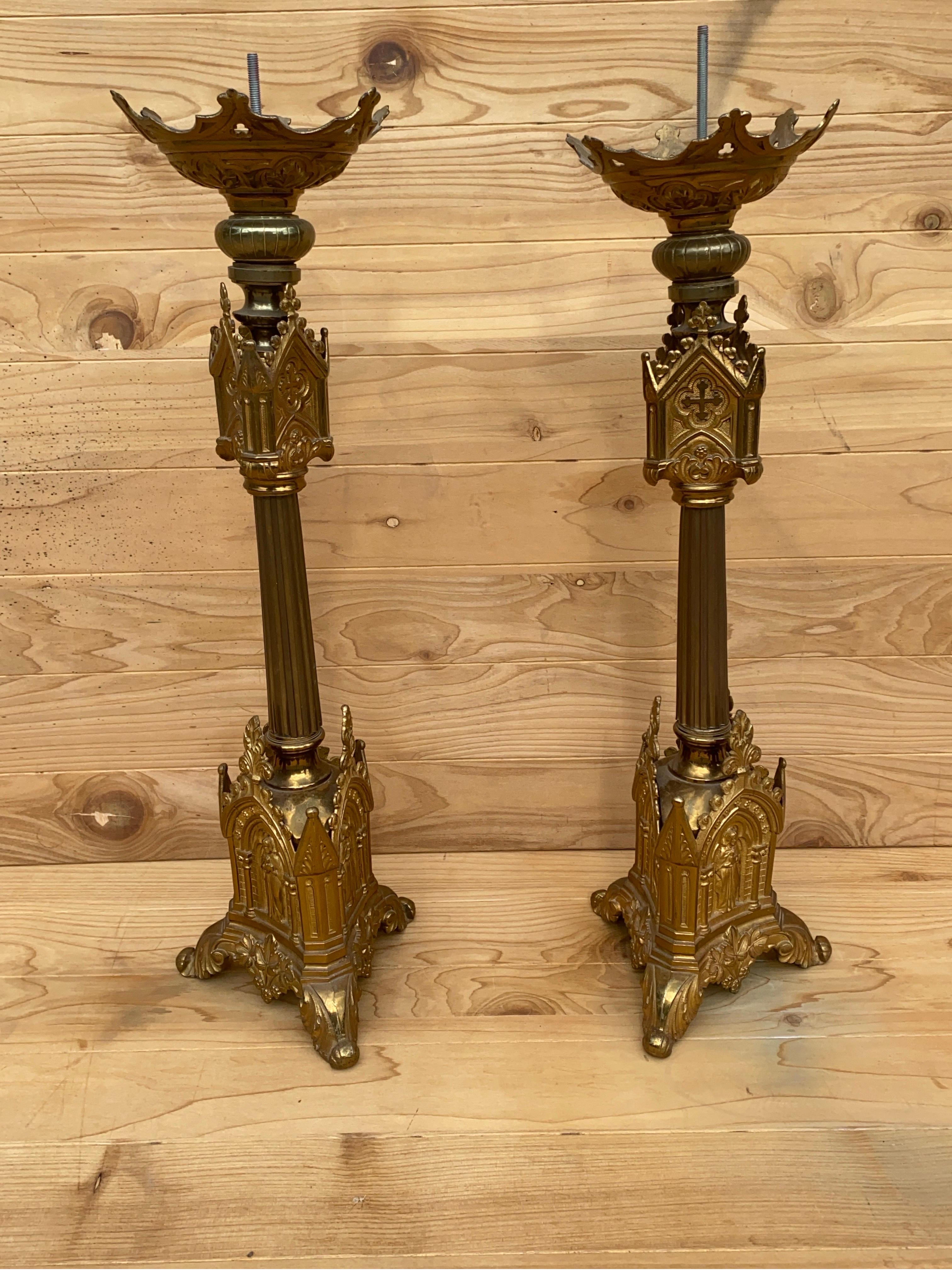 Antique French Neogothic Altar Torchère Candlestick Set w/ Jesus & Cross

This set of antique French candle holders are decorated with images of Jesus and crosses. Each candlestick rests on a three-legged base, and the top has a plate to catch wax.