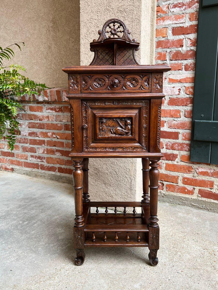 Antique French nightstand end table brittany breton marble carved oak cabinet

Direct from the Brittany region of France, an ornately appointed 19th century carved nightstand or end table.
True Breton style reflected throughout, with upper crown