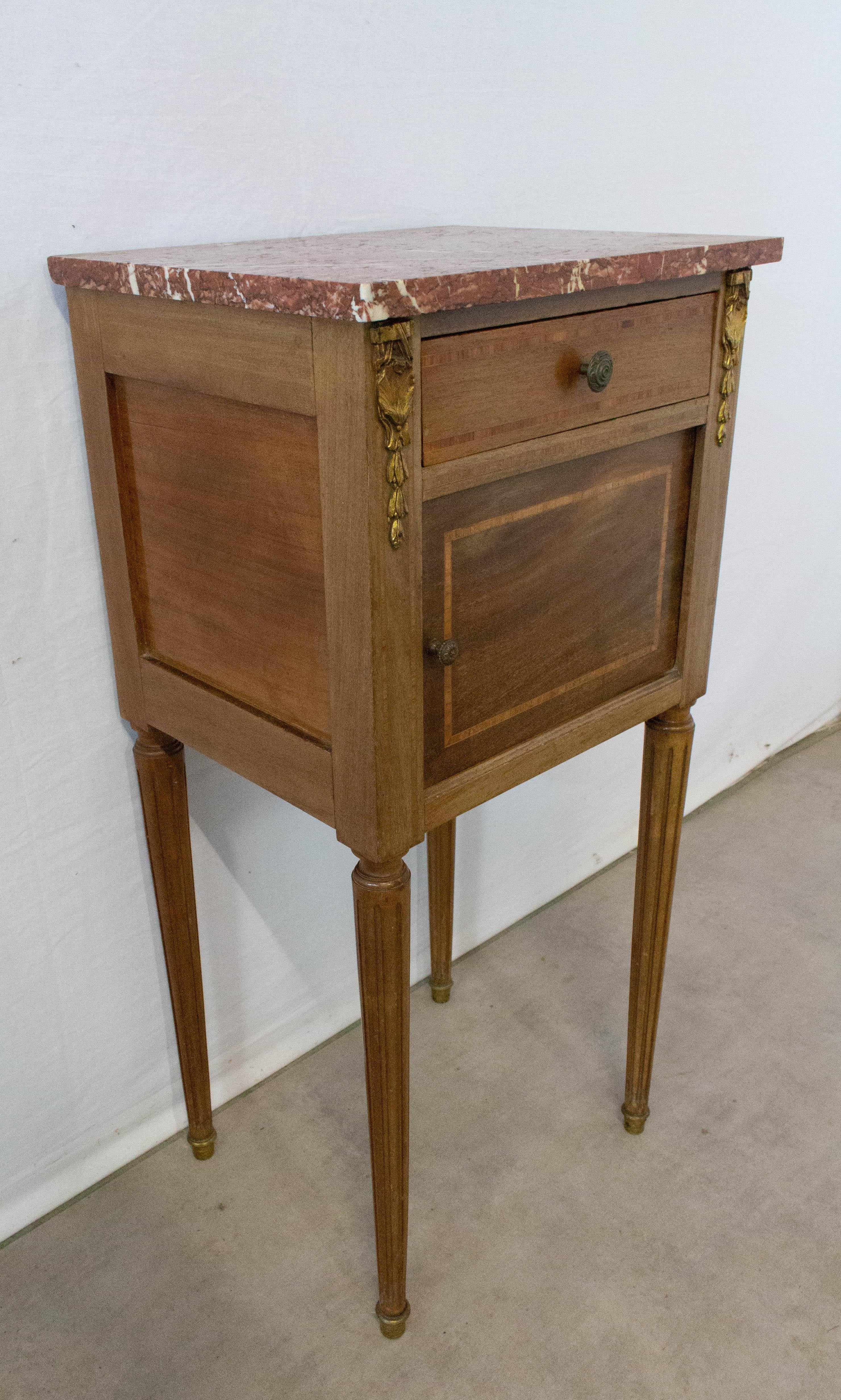 Antique French side cabinet nightstand bedside table
Rouge marble top, exotic wood inlay-ed and golden bronze
Single drawer
Cupboard with original porcelain liner that can be removed if preferred
Good antique condition for its age with only minor