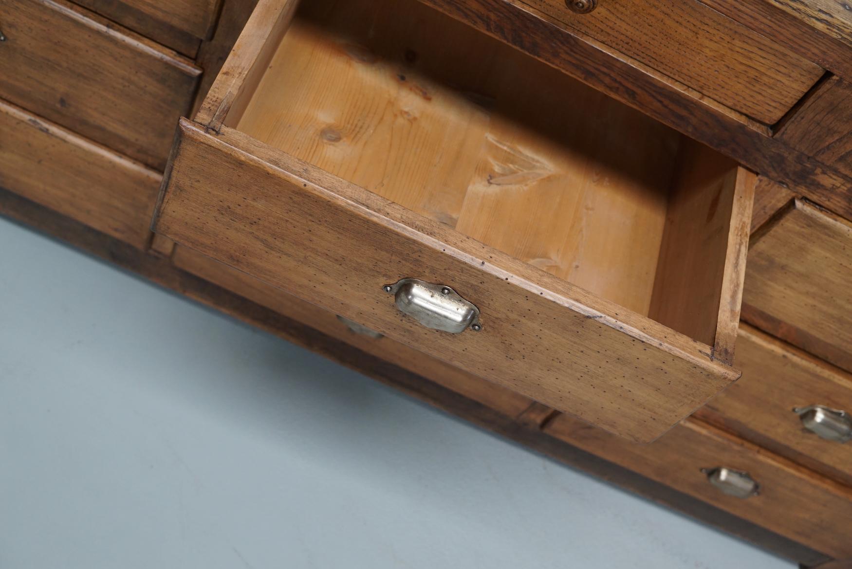 Antique French Oak and Beech Rustic Bank of Apothecary Drawers, Circa 1910 For Sale 12