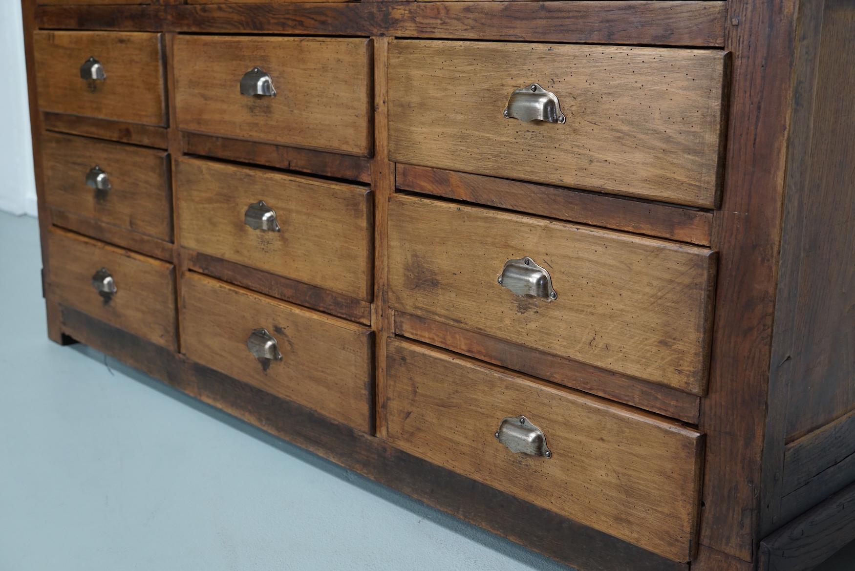 Industrial Antique French Oak and Beech Rustic Bank of Apothecary Drawers, Circa 1910 For Sale