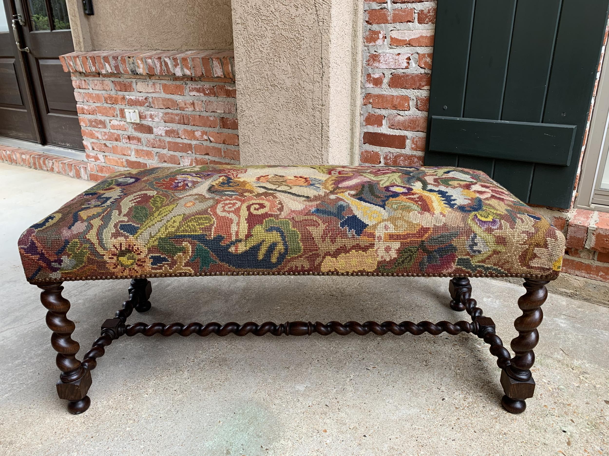 Antique French oak barley twist bench stool ottoman seat needlepoint Louis XIII

~Direct from France~
~Lovely and versatile antique French bench or ottoman~
~Extra long length with gorgeous barley twist legs, barley twist cross stretchers and a