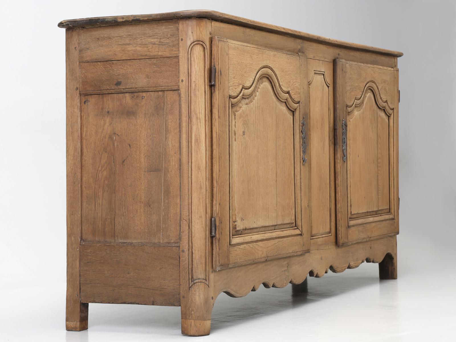 Antique French buffet or sideboard if you prefer to call it, was probably constructed in the late 1700s or very early 1800s and has somehow magically escaped the hands of any restorer. In the antique business, we always prefer to purchase an object,