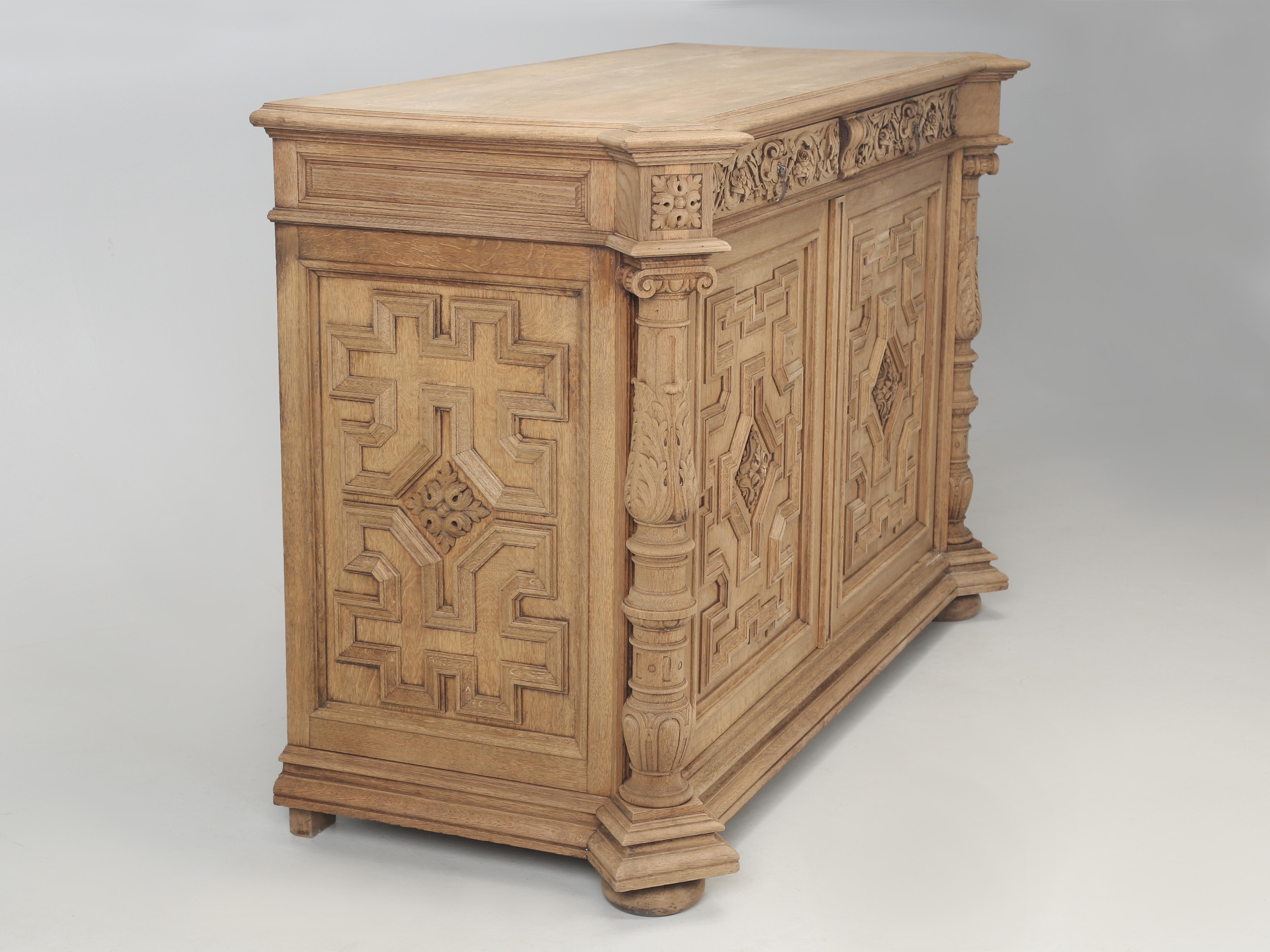Antique French Buffet made with extraordinary quality and attention to detail throughout. We only wish we knew the history for this incredible French white oak 2-door Buffet, for it may have been built by a maître artisan (master craftsman). The