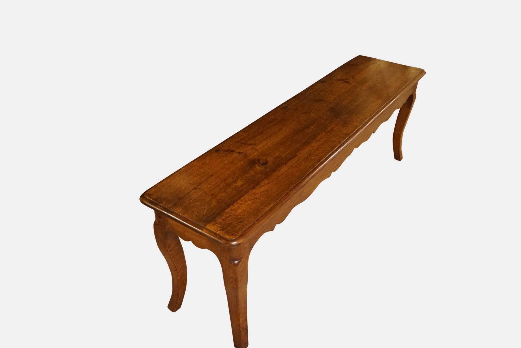 Antique French oak hall bench, raised on cabriole legs with shaped rails

circa 1900.
 