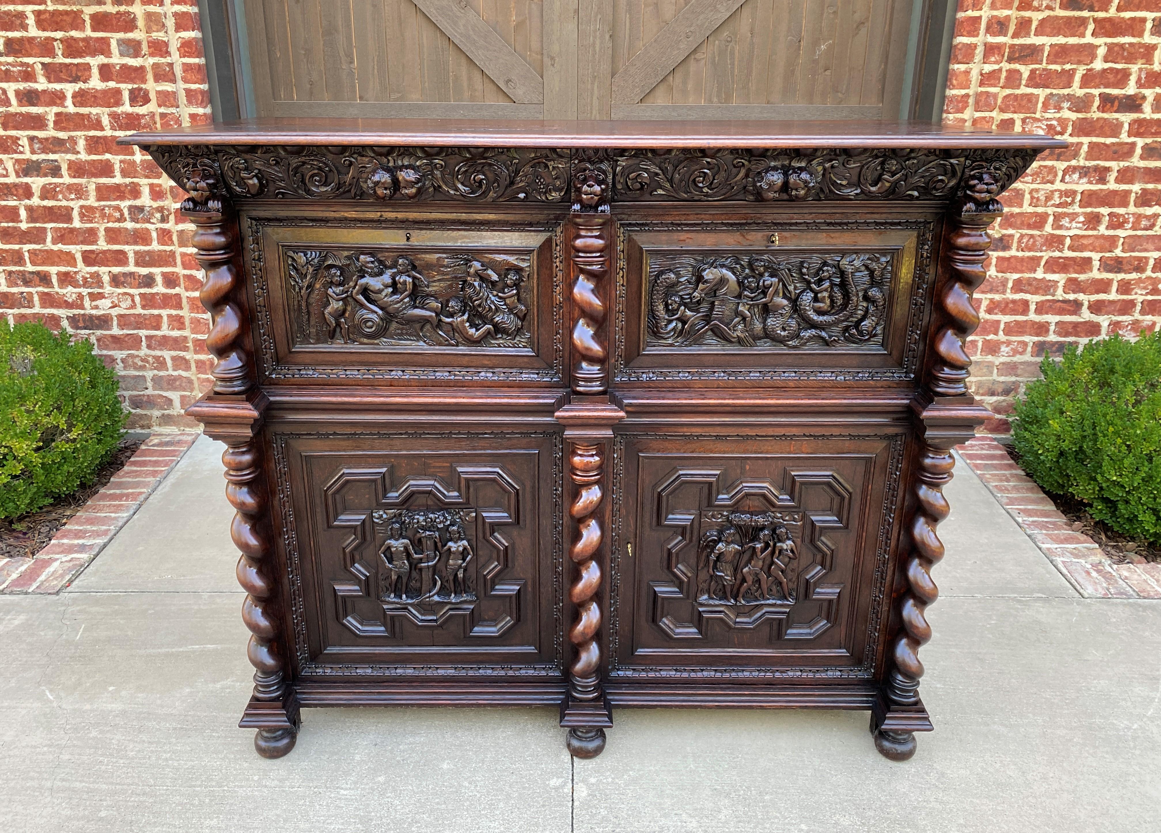 Superb antique french oak allegorical cabinet, sideboard, server, buffet, liquor cabinet or bar~~highly carved with barley twist pillars and biblical scene carvings ~~c.
1880s 

This is a must see! Outstanding 19th century French oak exquisitely