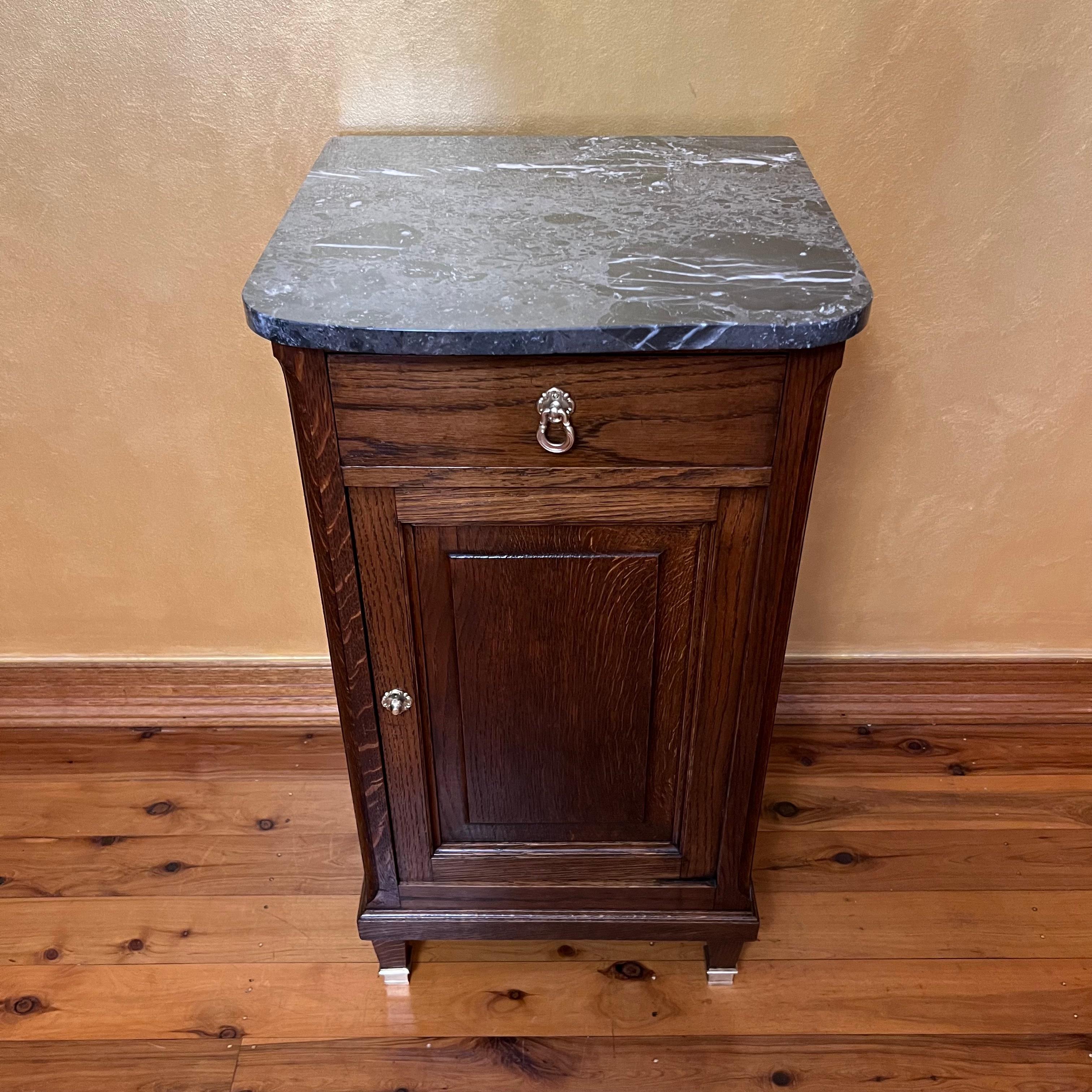 Grey marle marble top, has top draw bottom cupboard has two shelves inside, Brass fitting on front feet, brass fittings have been polished to original colour, has been French polished.

Circa: 19th Century  

Material: Oak

Country Of Origin: France