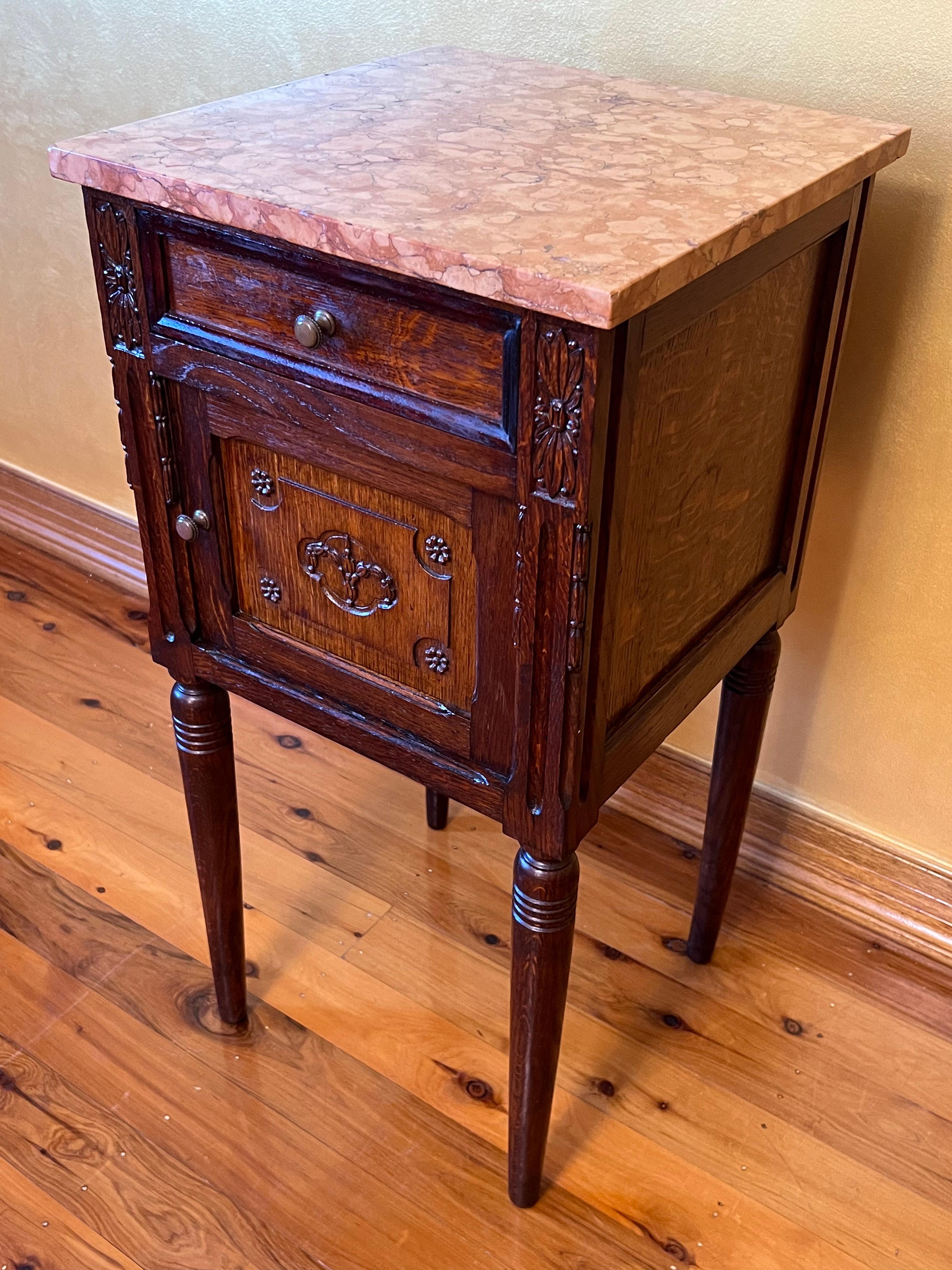 Marble topped nightstand, straight legs with ring carved detail, carved detail on front door cupboard and side pillars.

Circa: 19th Century

Material: Oak

Country of Origin: France

Measurements: 82.5cm high, 41cm width, 39cm depth