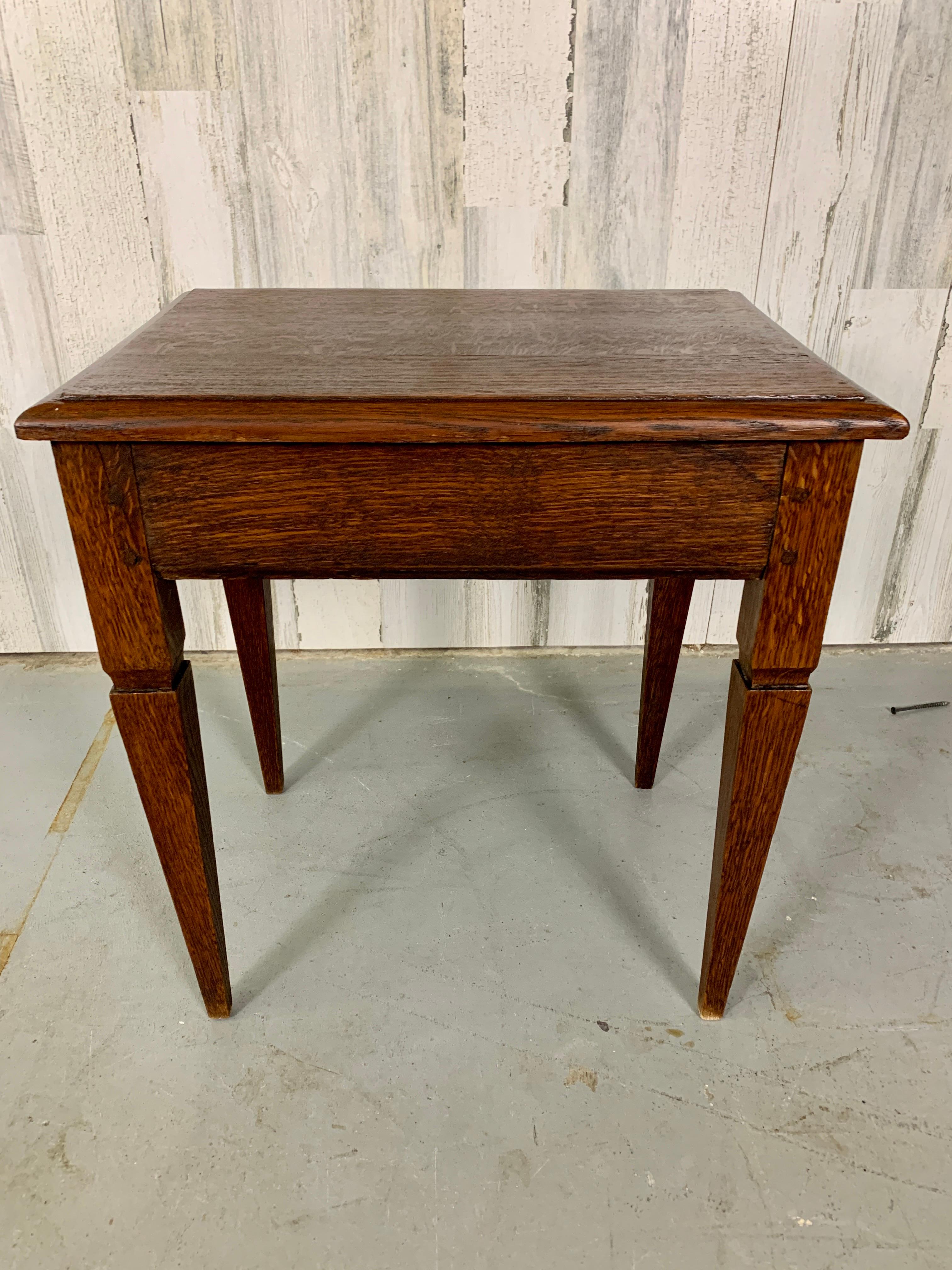 Antique French oak side table in the Directoire style with mortise and tenon joints.